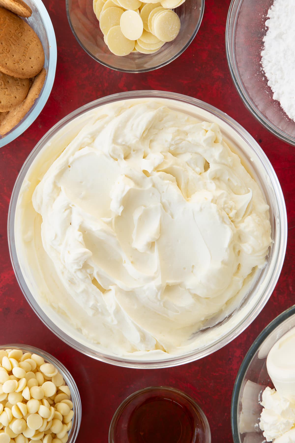 whisked cream cheese and double cream icing mix in a large clear bowl.