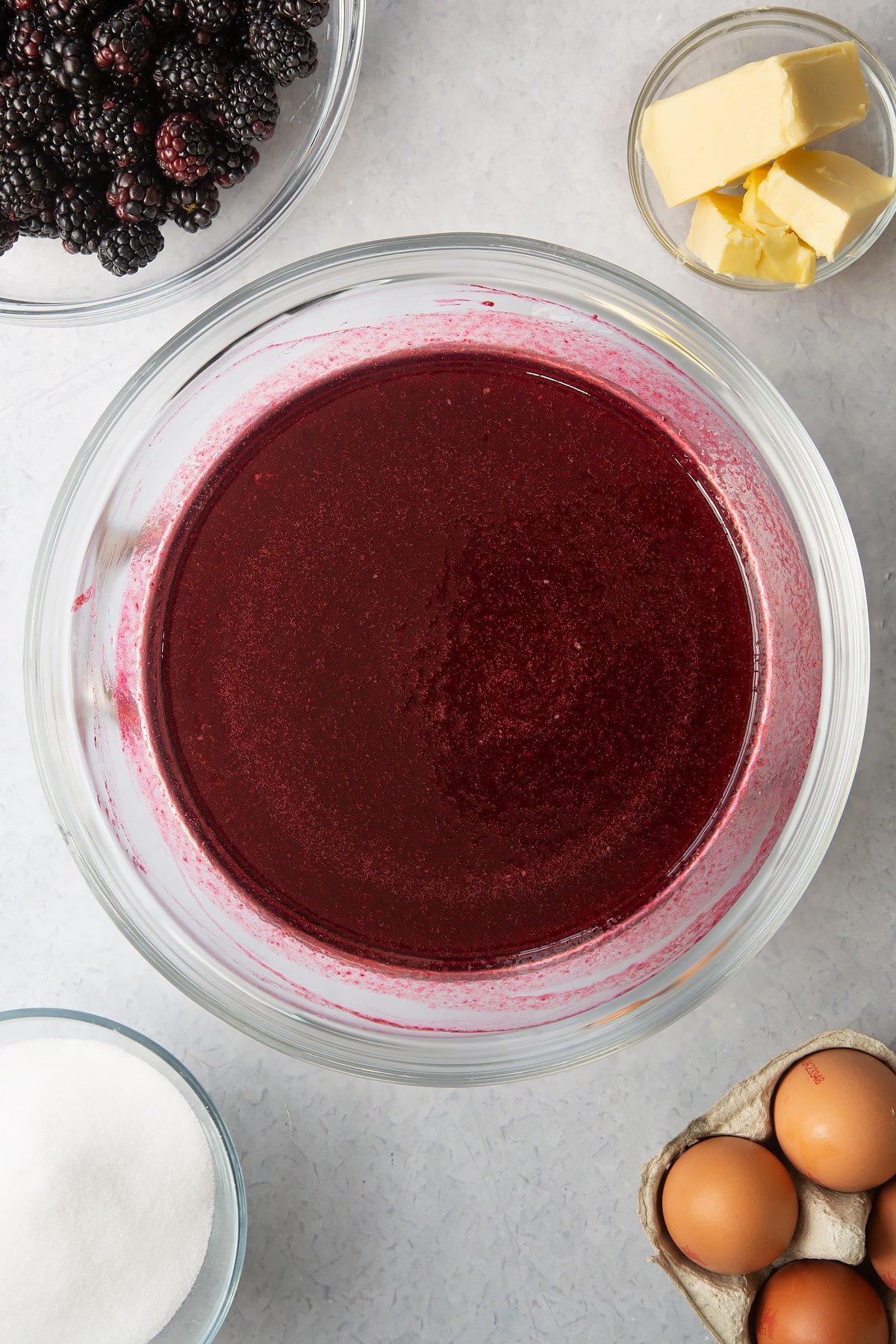 blackberry juice mixture in a large clear bowl.