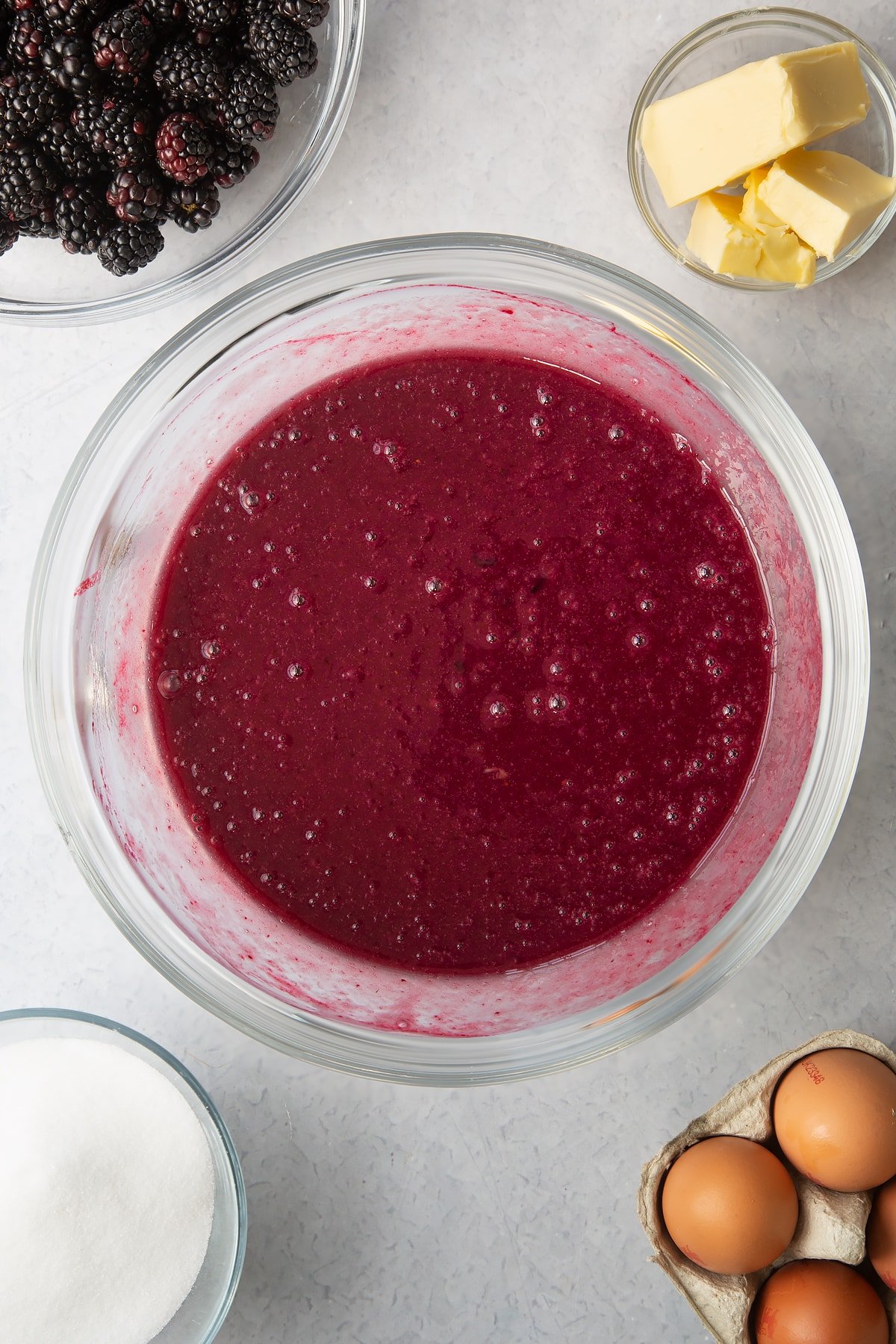 blackberry juice mixture in a large clear bowl.