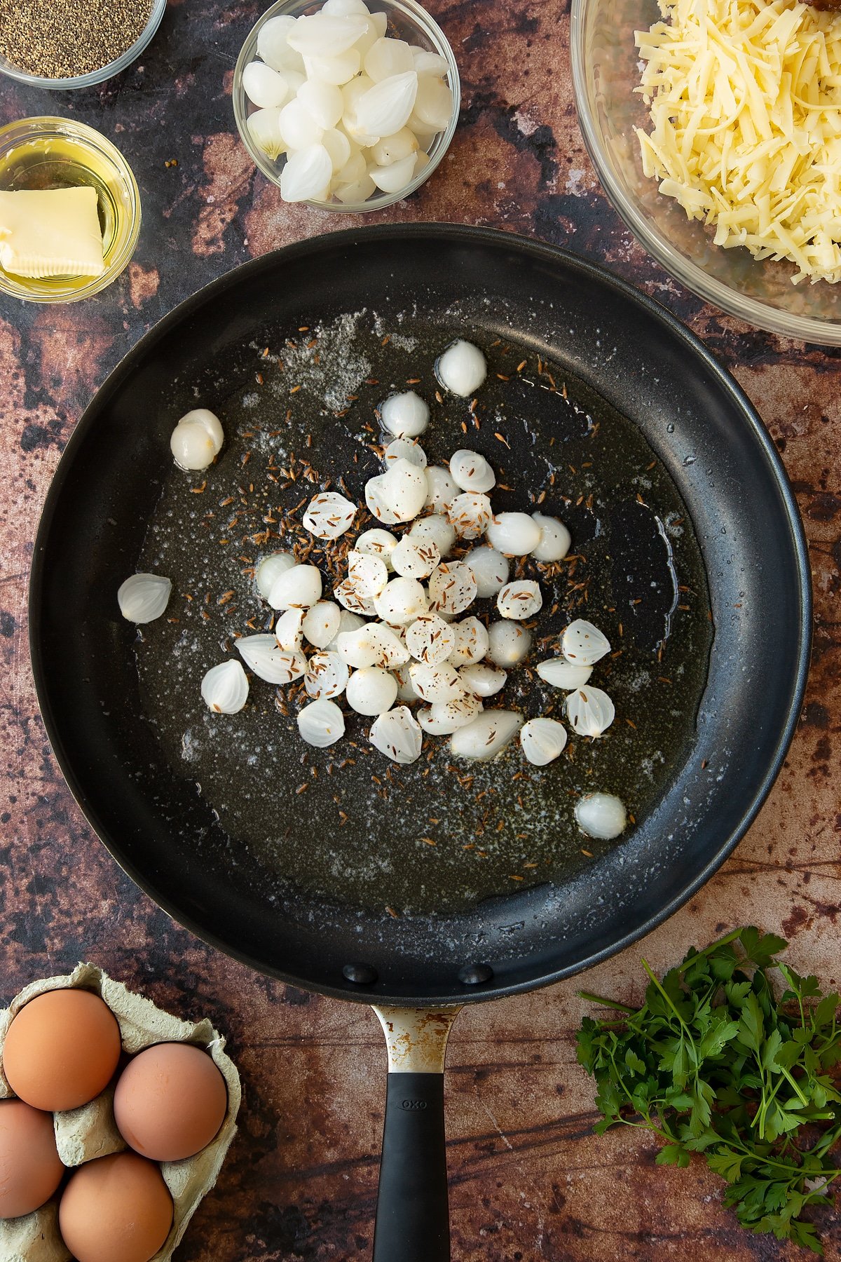 Overhead shot of some of the ingredients required for the mini cornish pasties in a pan.