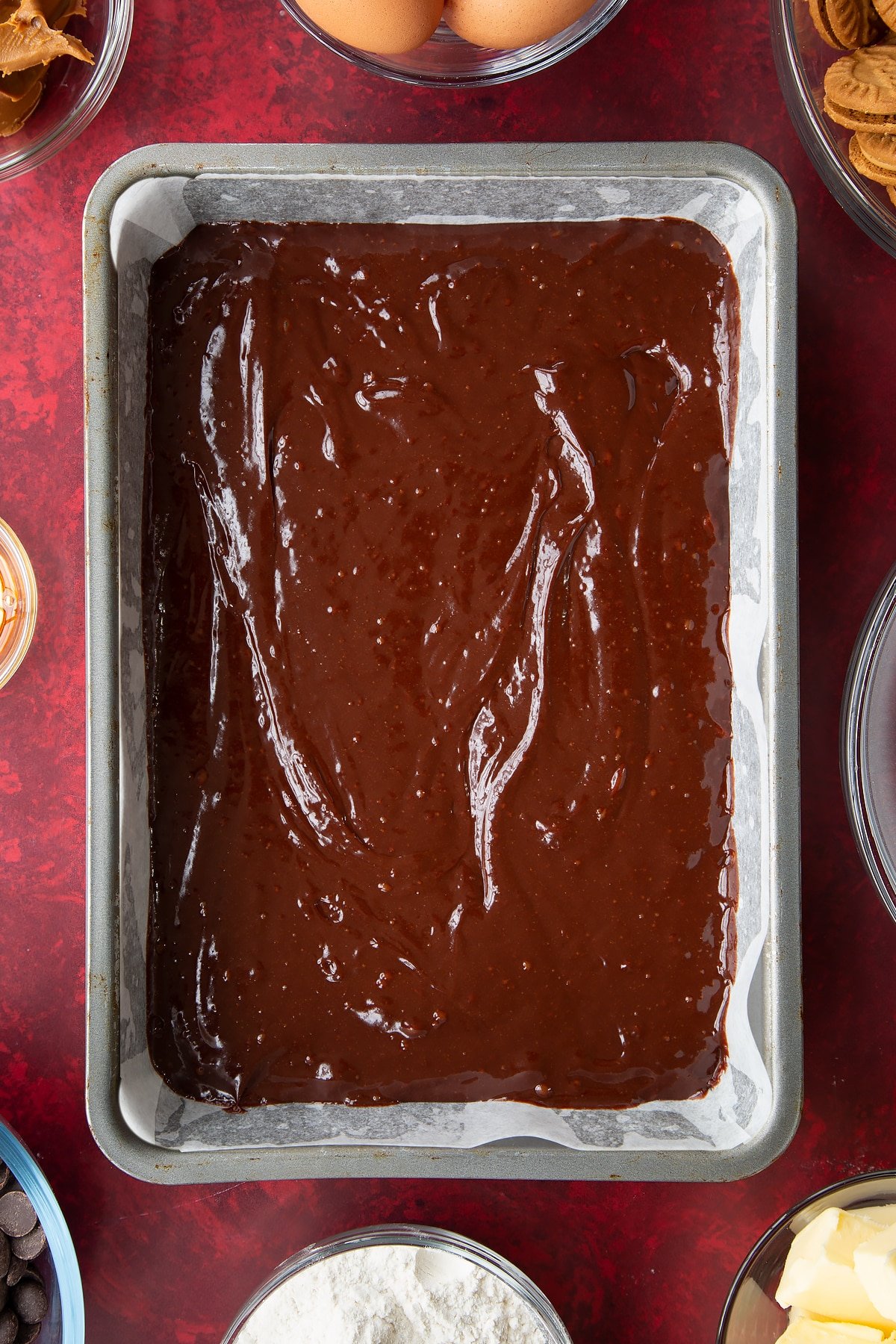 brownie batter in a lined baking tin.