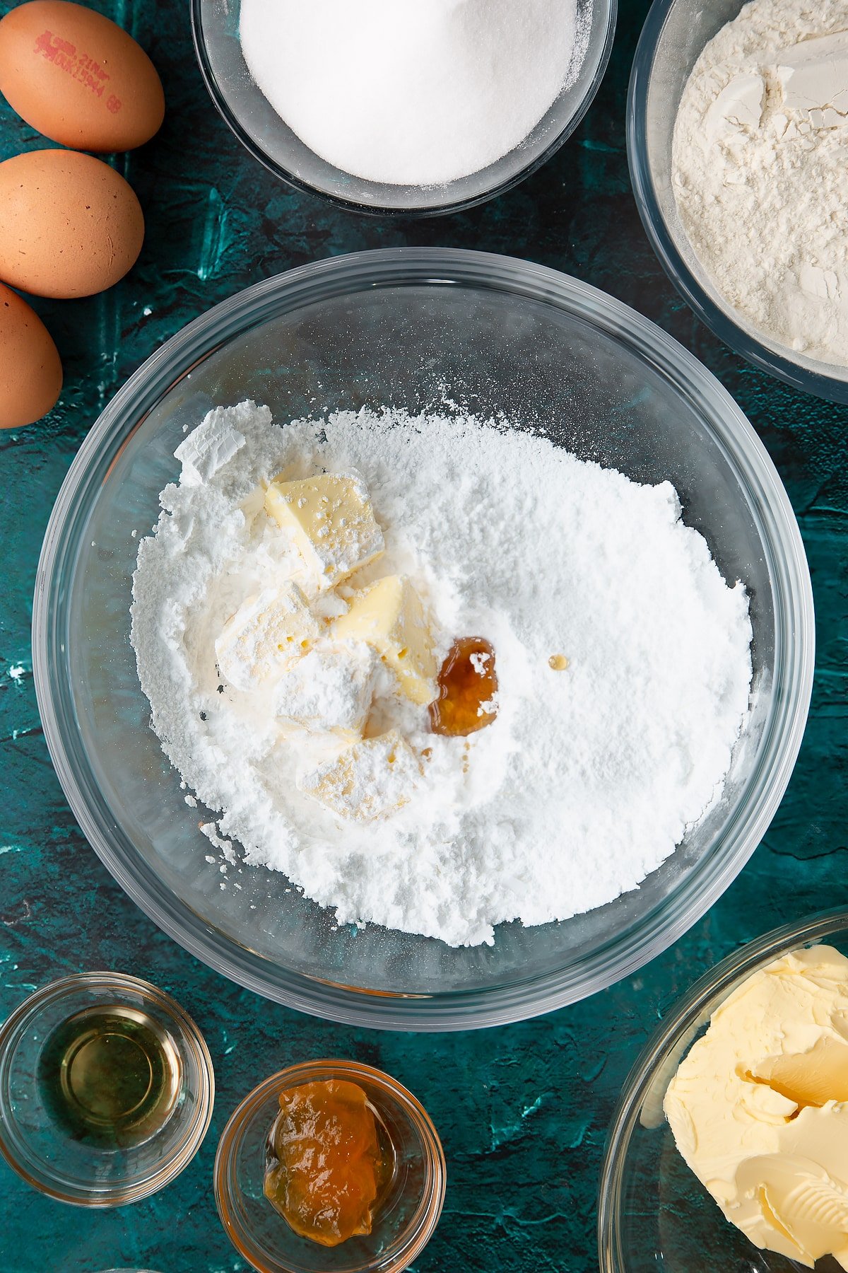 softened butter and vanilla in a bowl and sifted icing sugar.