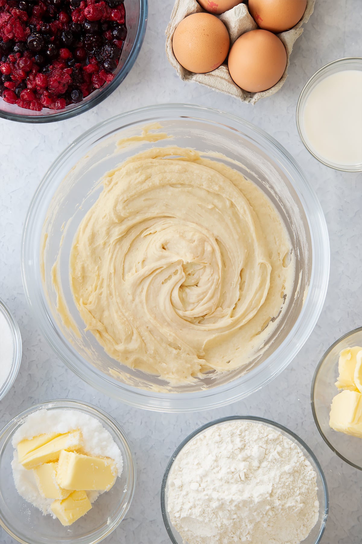 whisked vanilla cake batter mix in a large clear bowl.