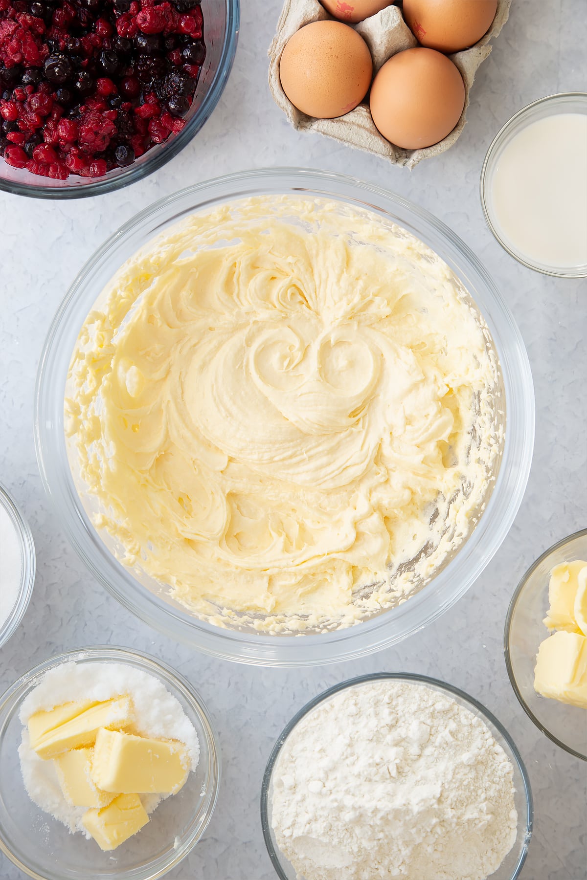 whisked cake batter mix in a large clear bowl.