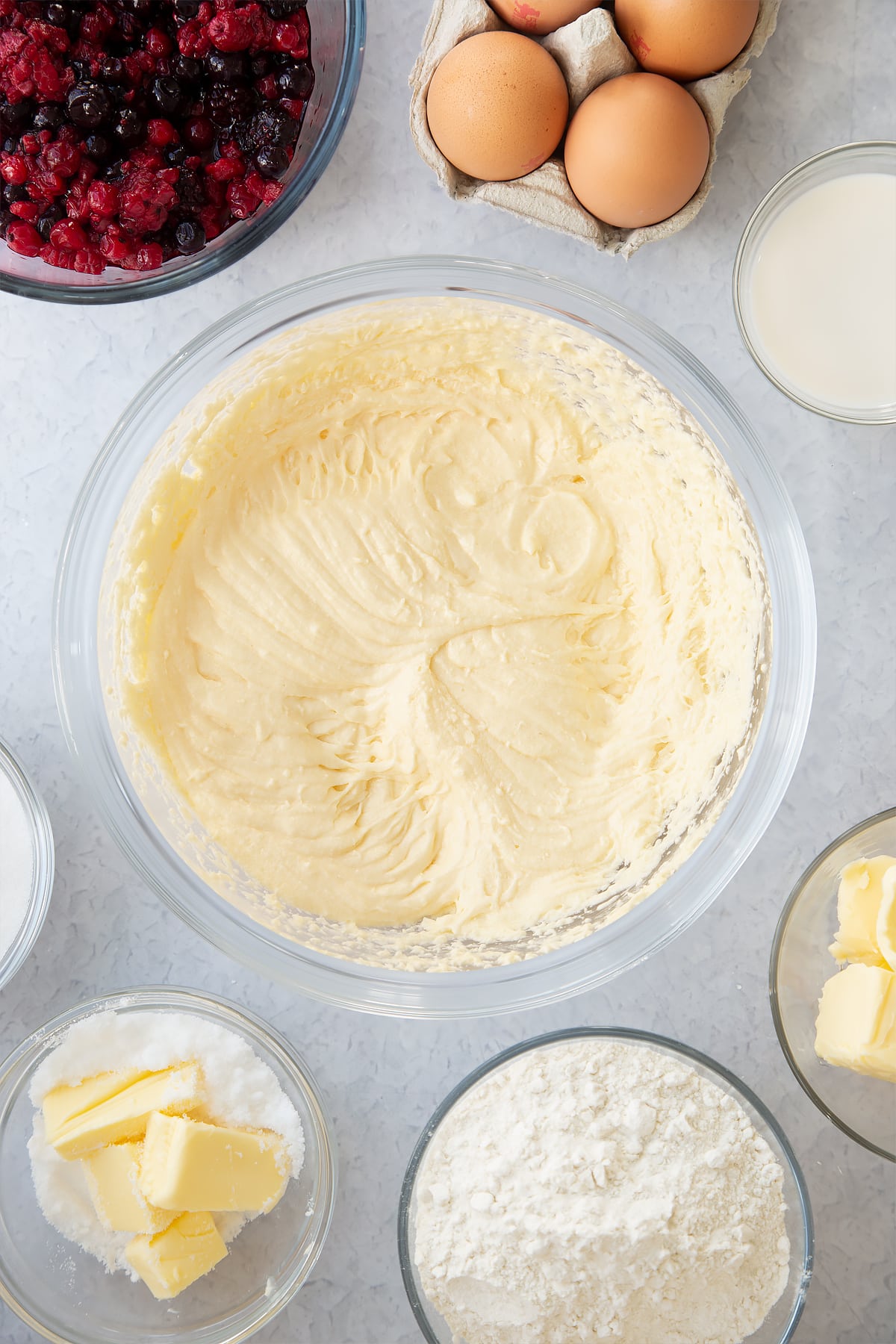 whisked cake batter mix in a large clear bowl.