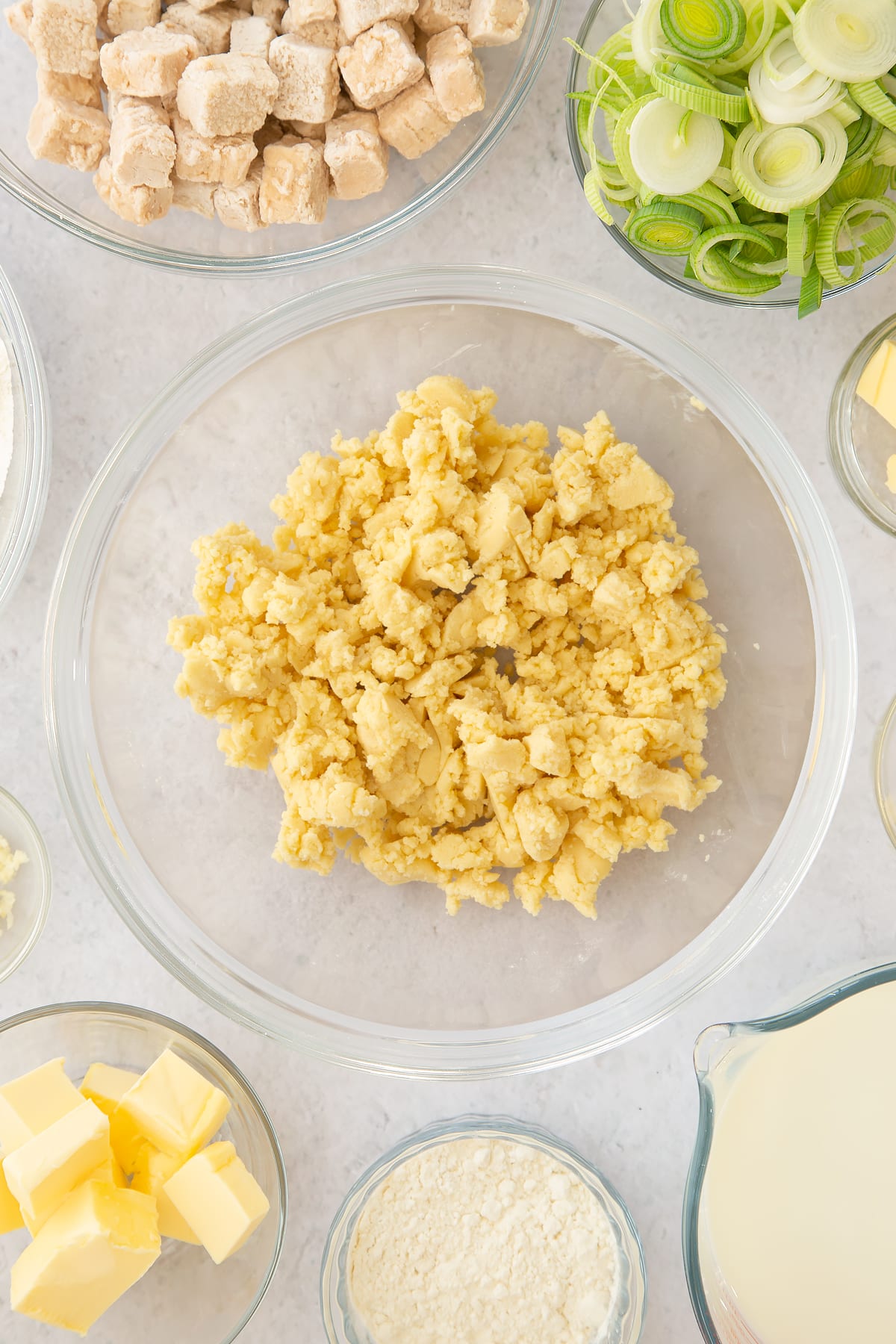 large butter and flour chunks in a large clear bowl.