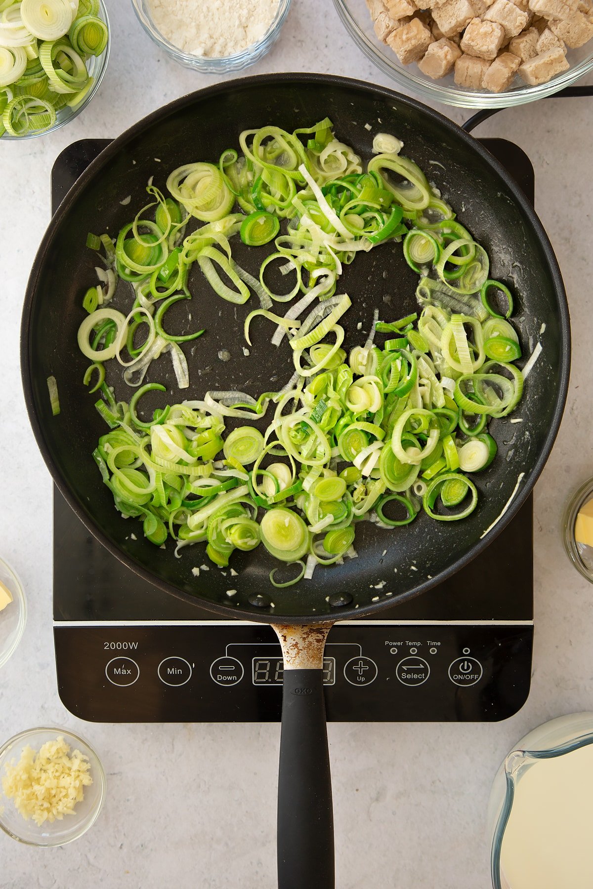 cooked sliced leeks  and garlic in a large frying pan.