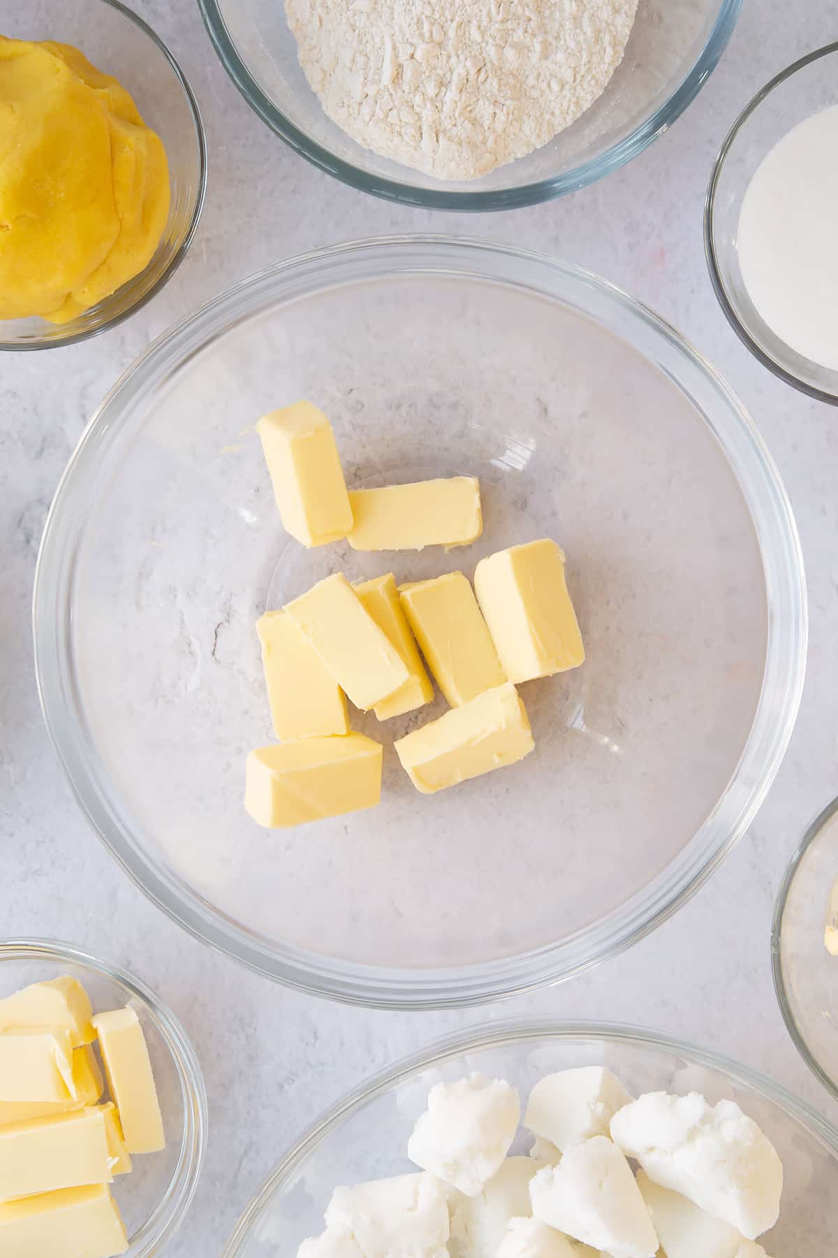 Softened butter in a mixing bowl.