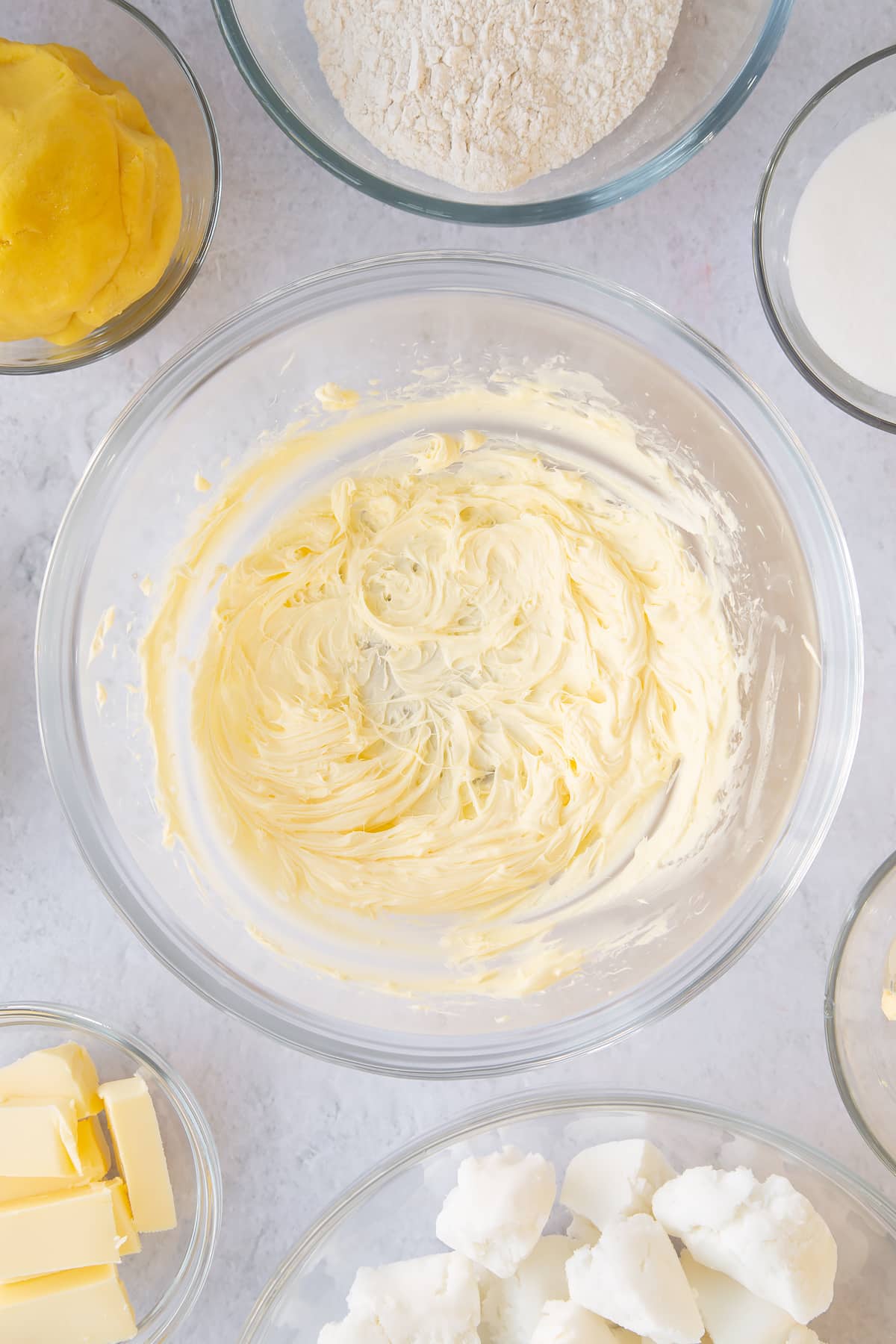 Whisking the butter until creamy and pale.