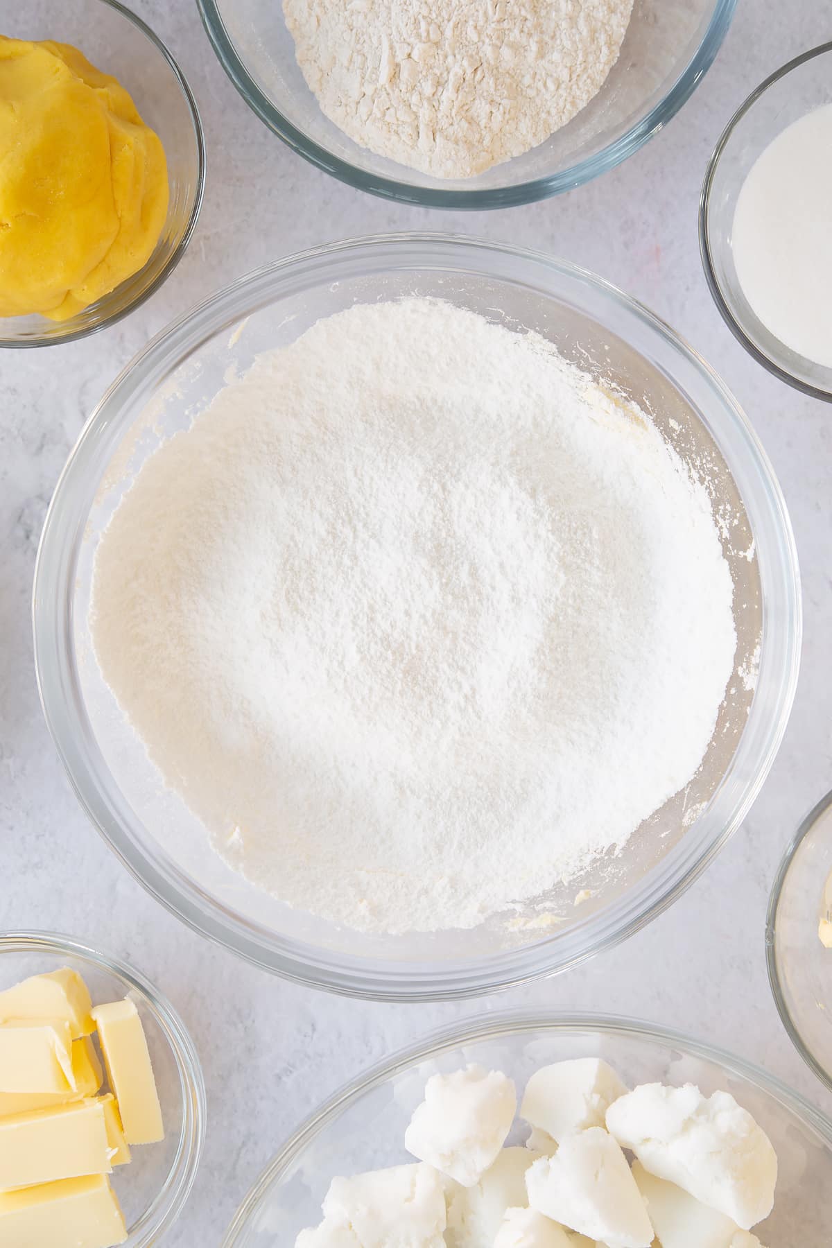 Sieving the icing sugar into the mixing bowl.