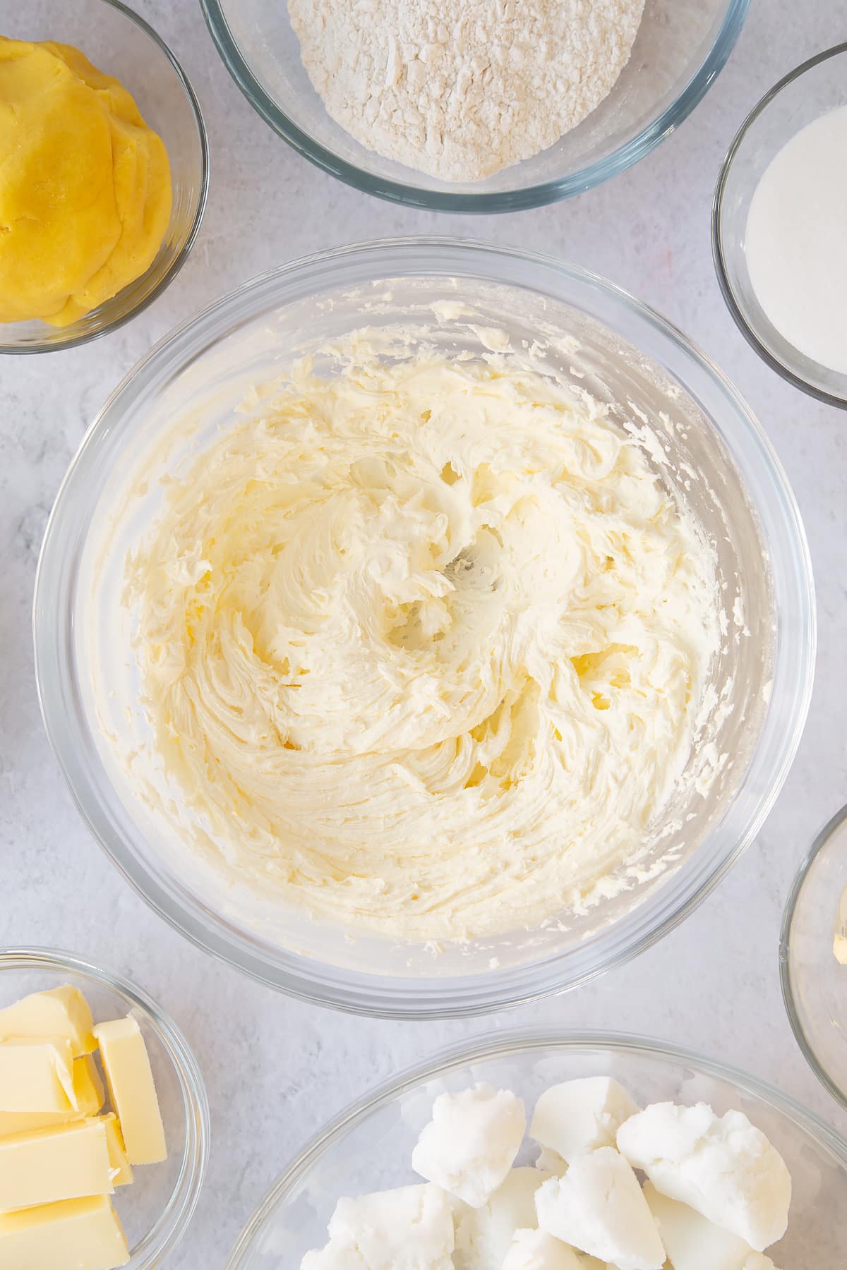 Whisking the ingredients in the mixing bowl together.