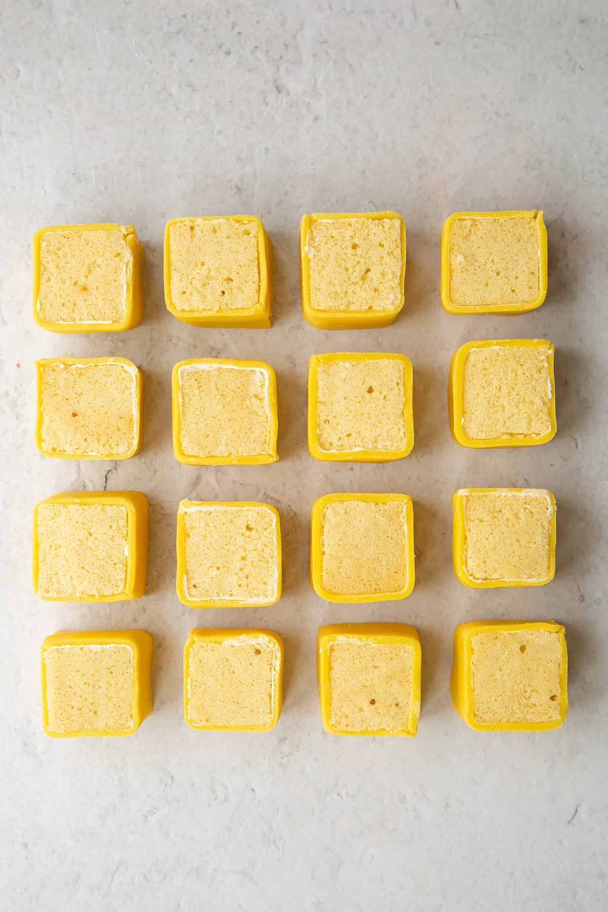 16 finished squares with marzipan rolled around the edges.