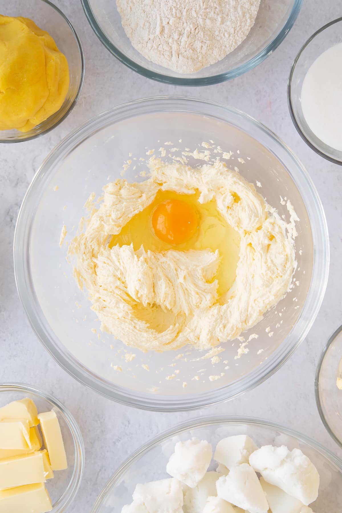 Whisking eggs into the mixture. 