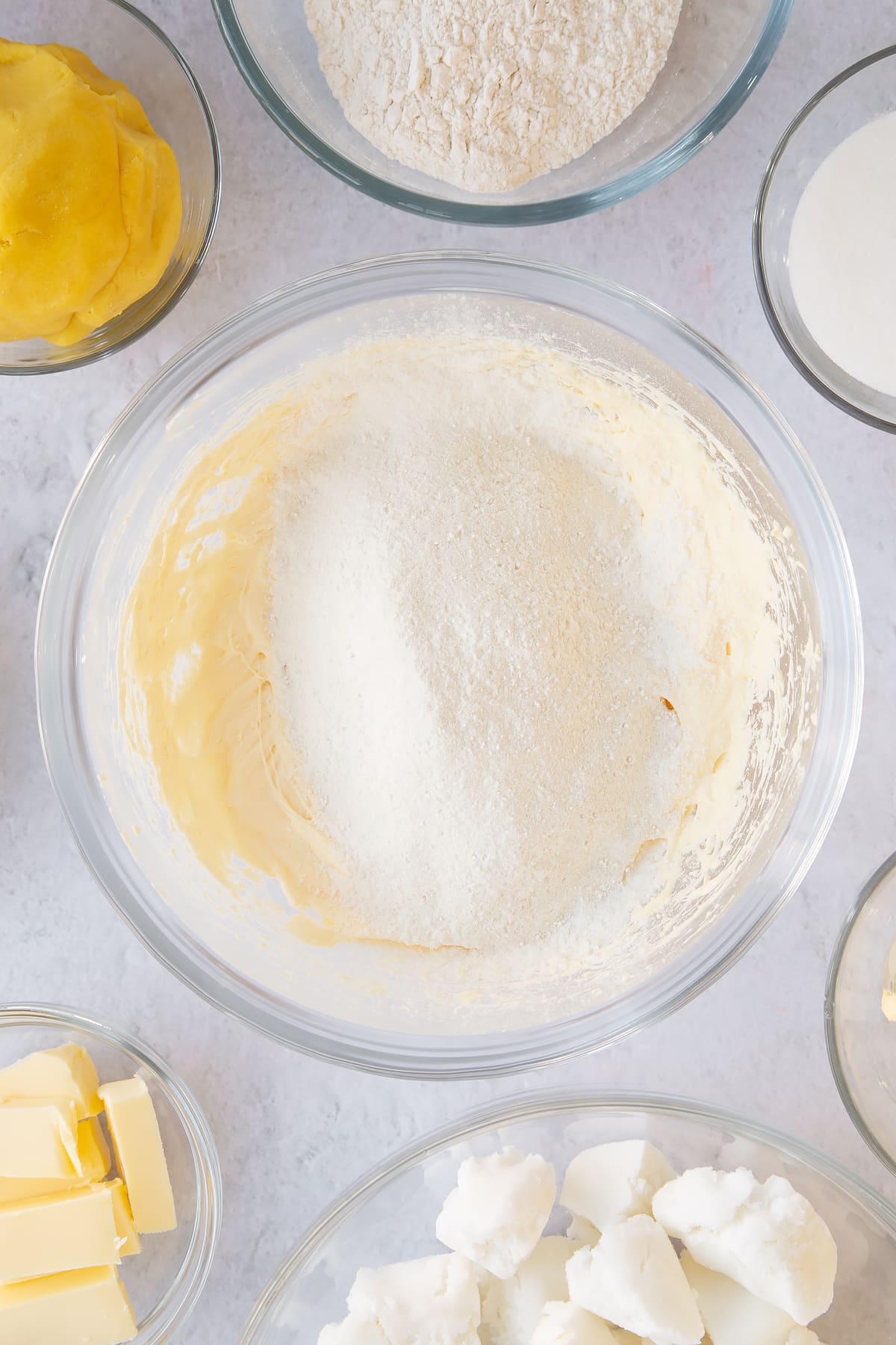 Sifting flour and baking powder into the mixing bowl.