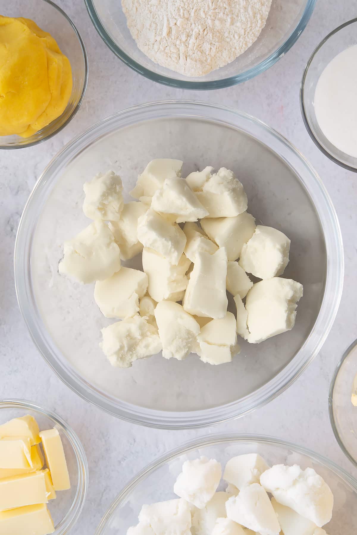 Chopped white icing in a saucepan.