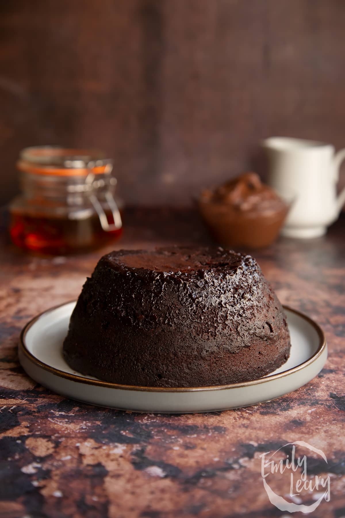 baked Nutella pudding cake on a white plate.