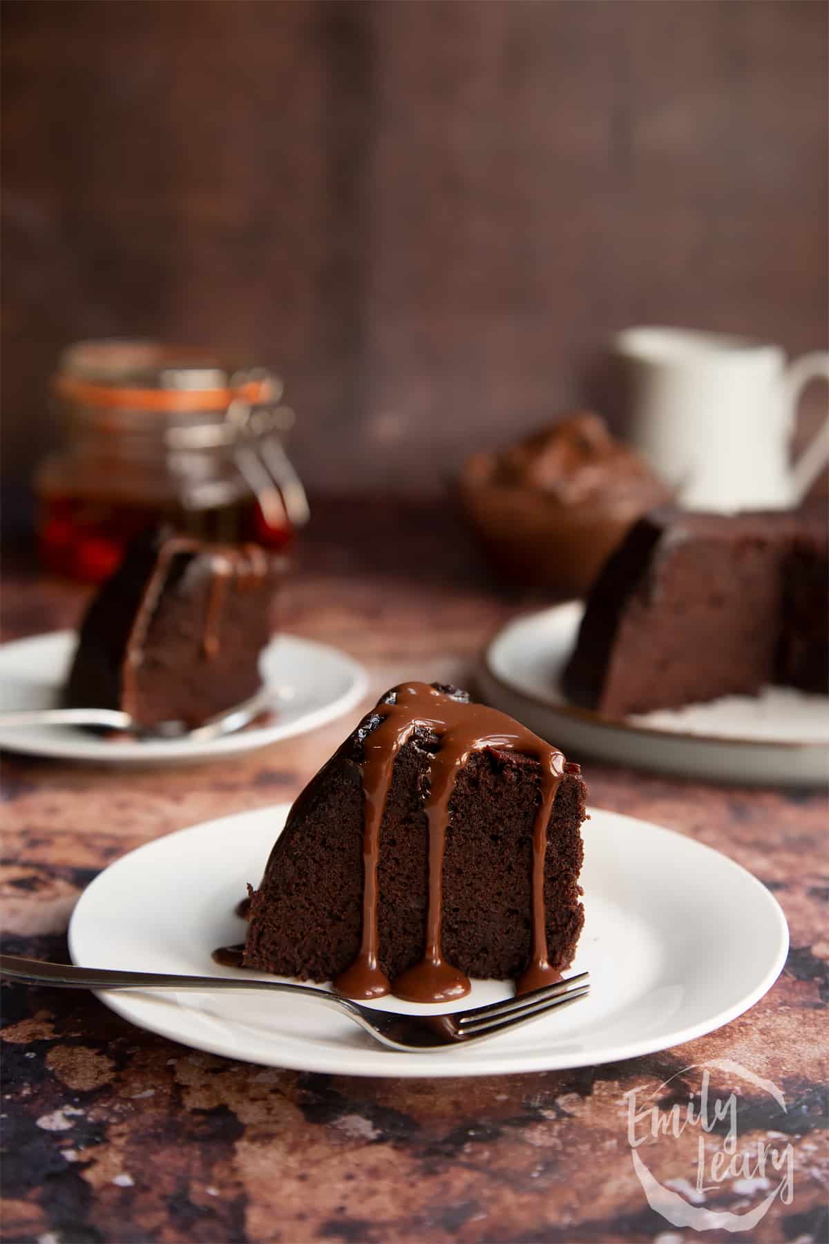 a slice of Nutella pudding cake on a white plate with a fork at the front.