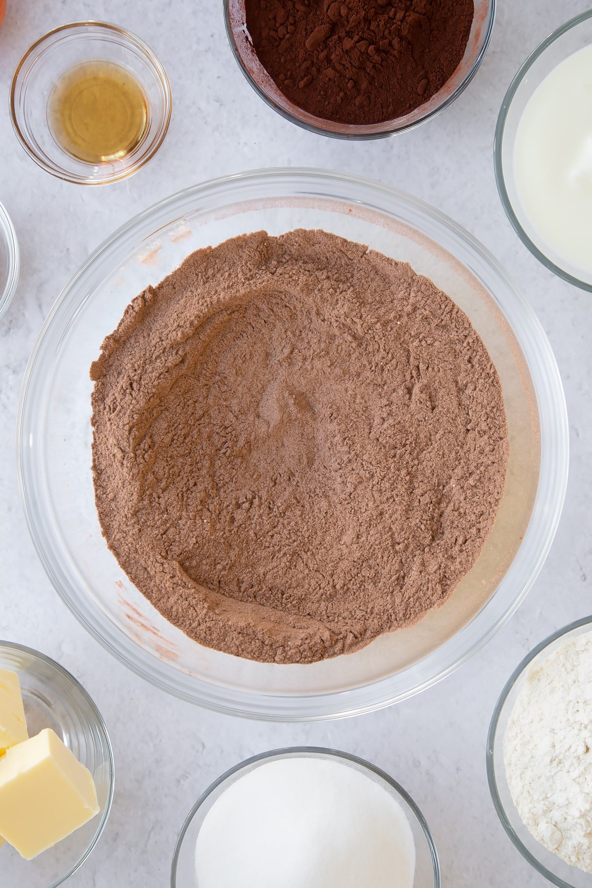 mixed flour, cocoa powder and baking powder in a large clear bowl.