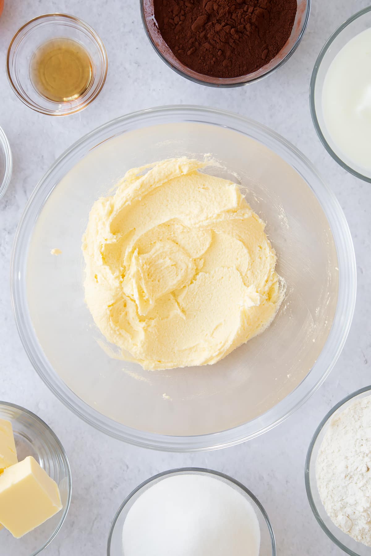 whisked butter and sugar mix in a large clear bowl.