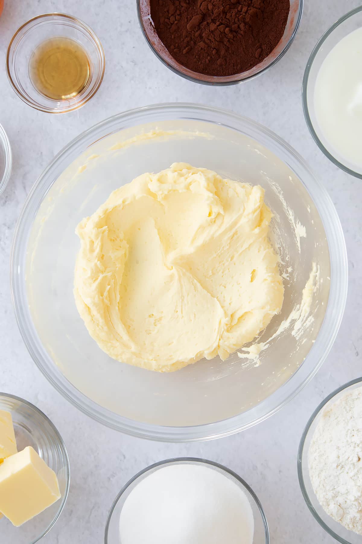 whisked butter, egg and sugar mix in a large clear bowl.