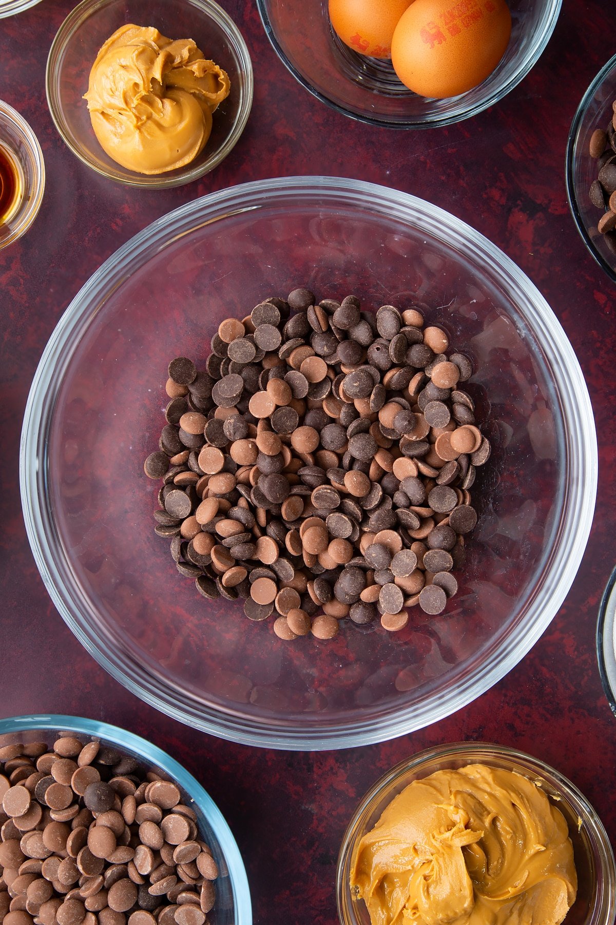 milk and dark chocolate chips in a large clear bowl.