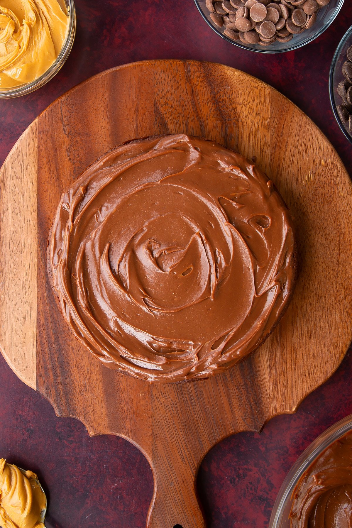 a chocolate cake topped with chocolate peanut butter ganache. 