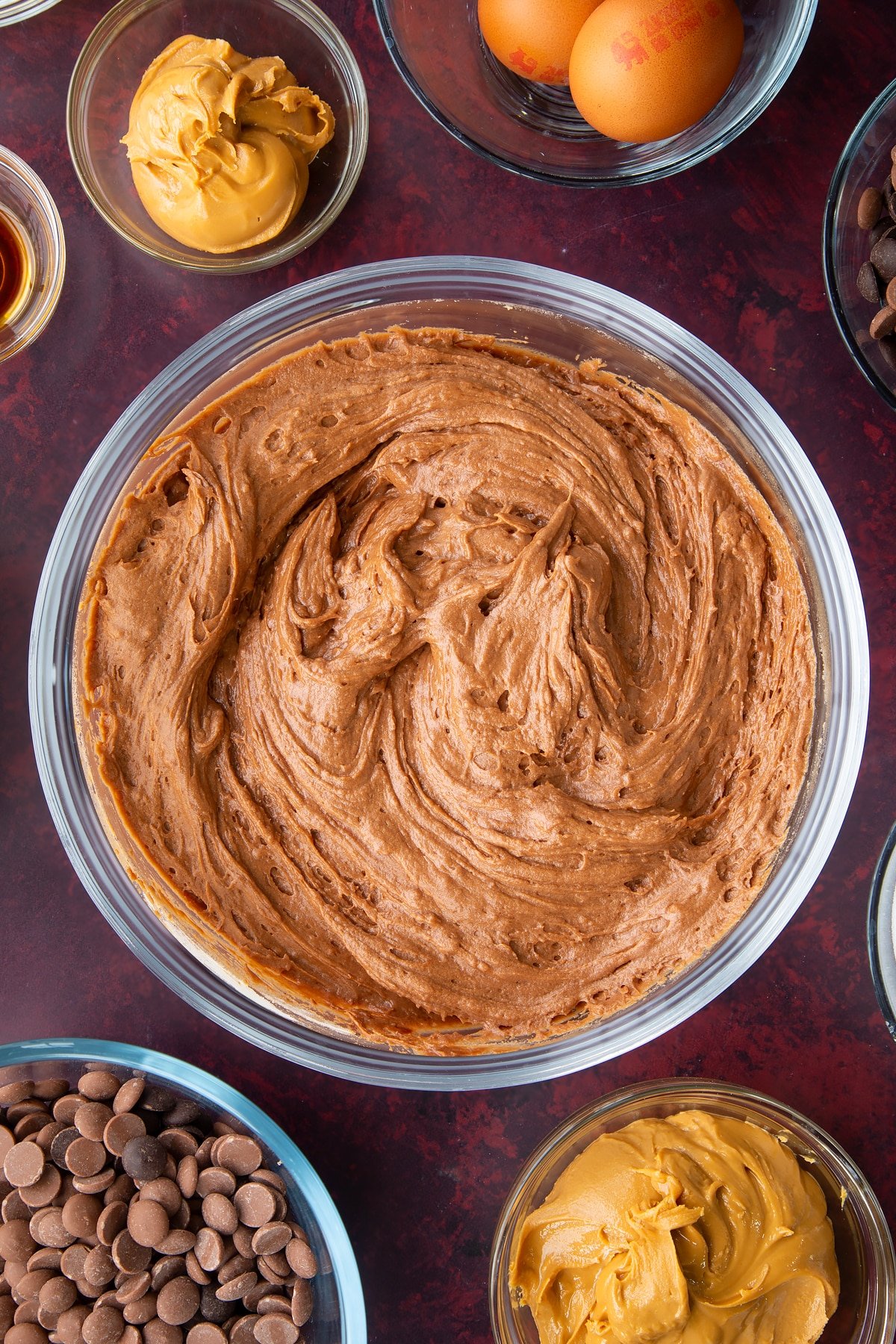 mixed chocolate and peanut butter batter in a large clear bowl.