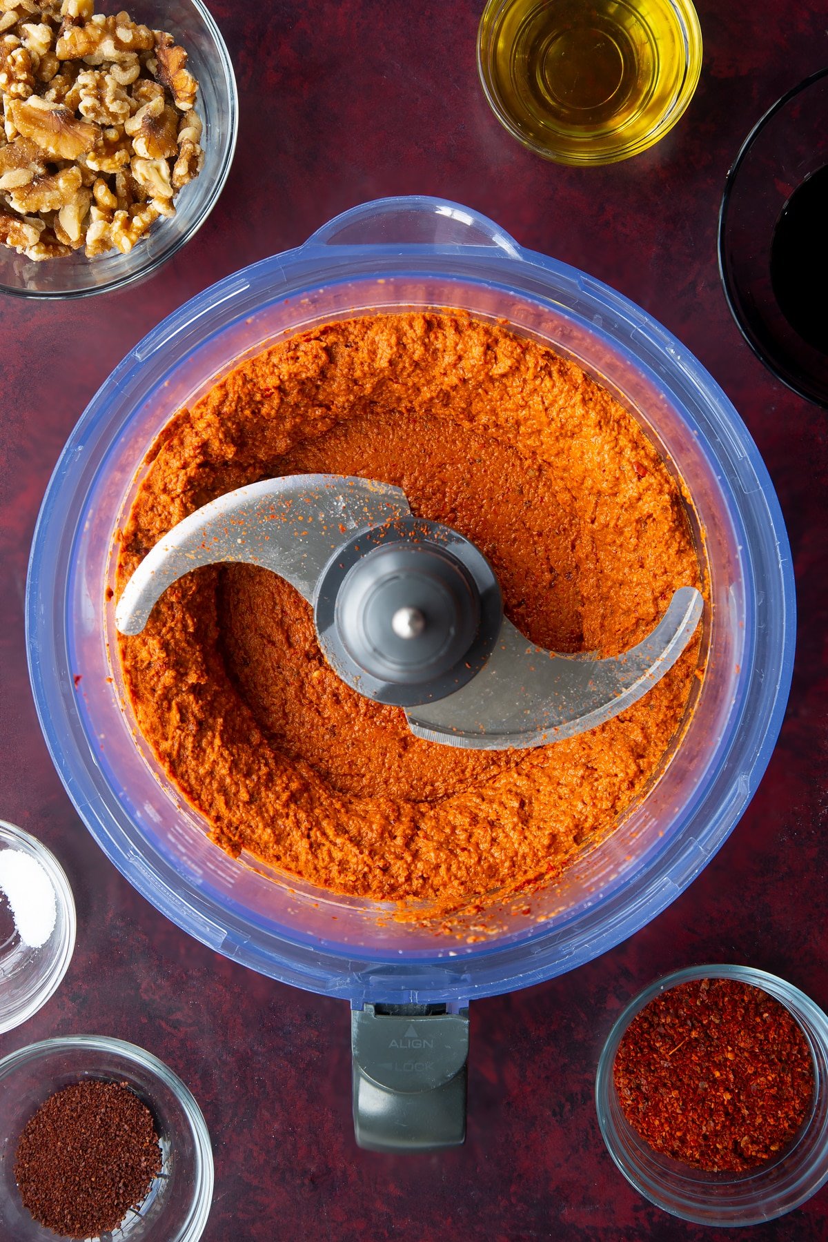 blended peppers, walnuts, olive oil, tomato puree, Aleppo pepper, pomegranate molasses, sumac in a food processor.