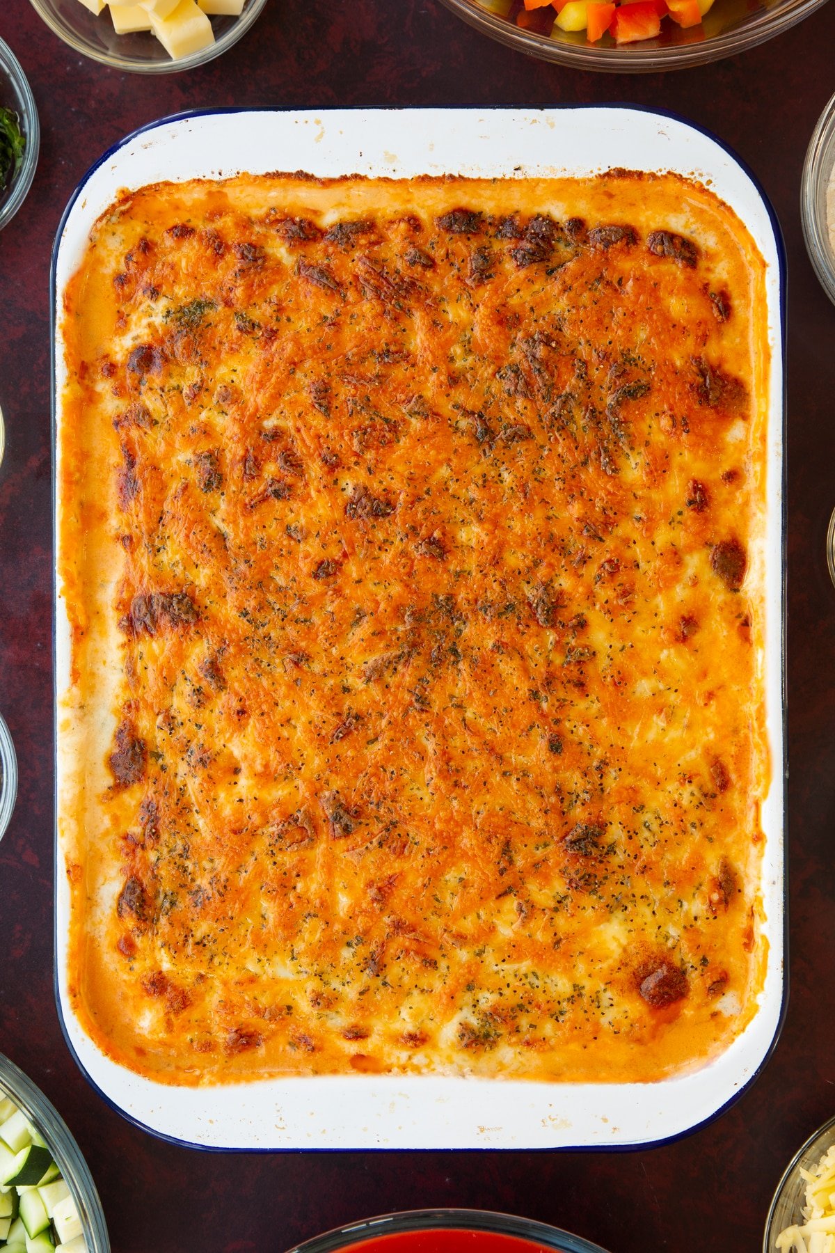 Overhead shot of the vegetarian potato lasagne having just been taken out of the oven.