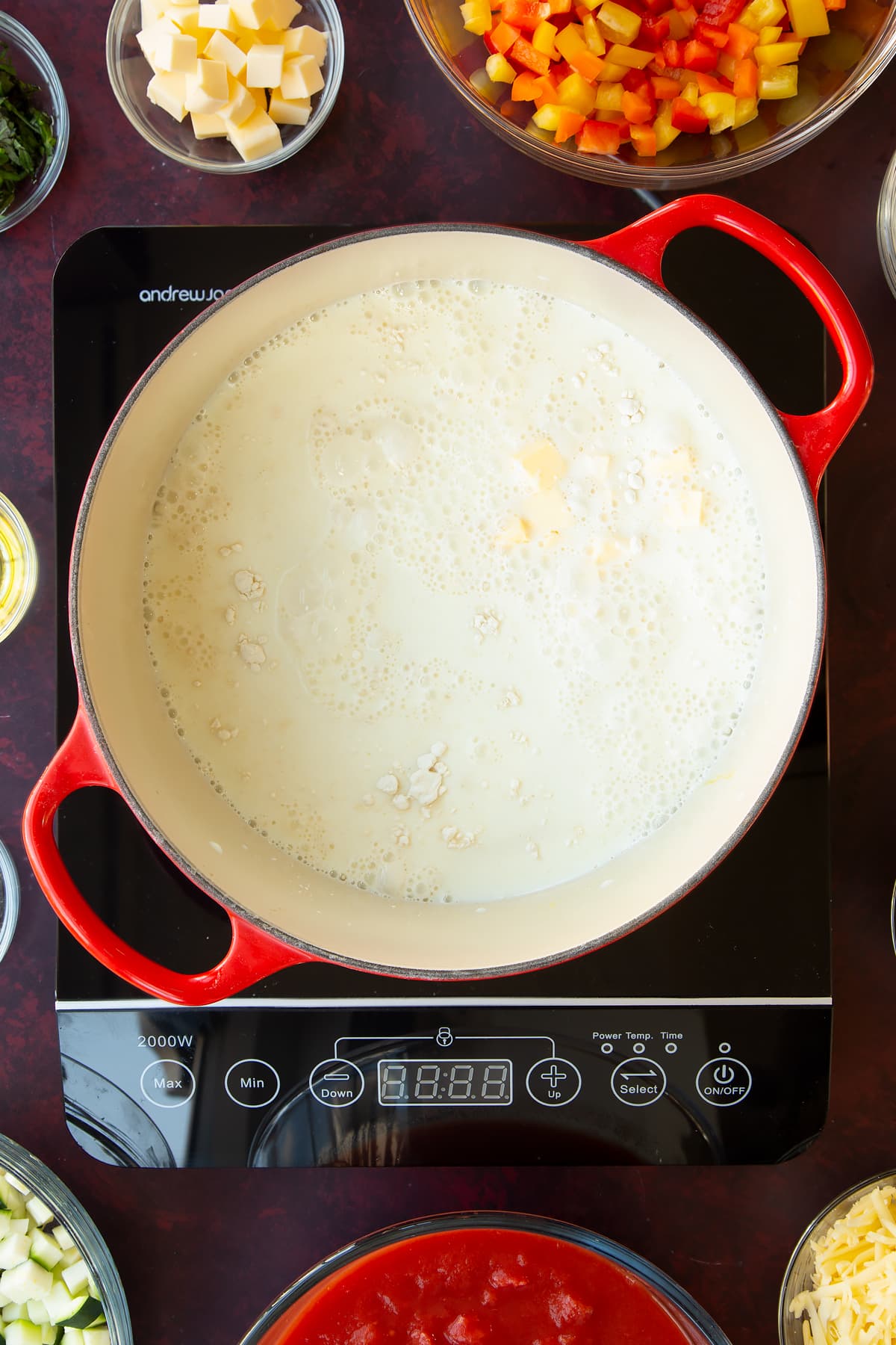 Overhead shot of milk, flour and butter in a non-stick pan.