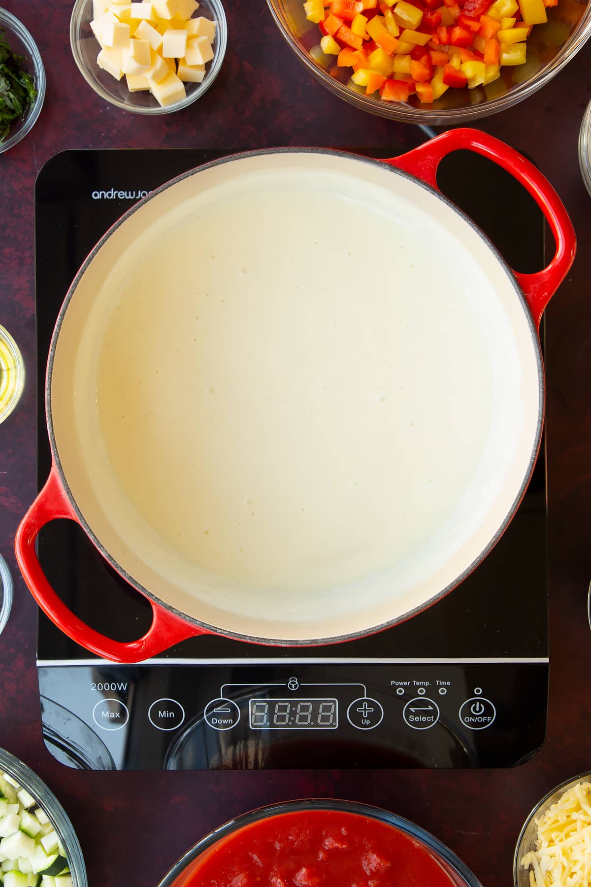 Overhead shot of the milk, flour and butter in a non-stick pan having been on the hob for five minutes.