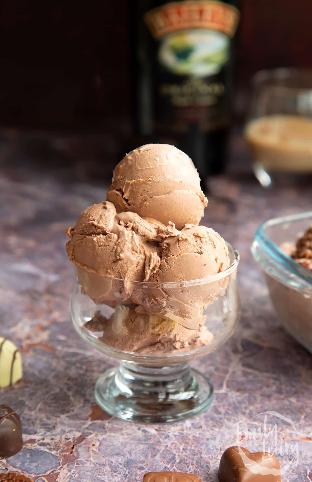 baileys ice cream in scoops in a glass dsessert bowl.