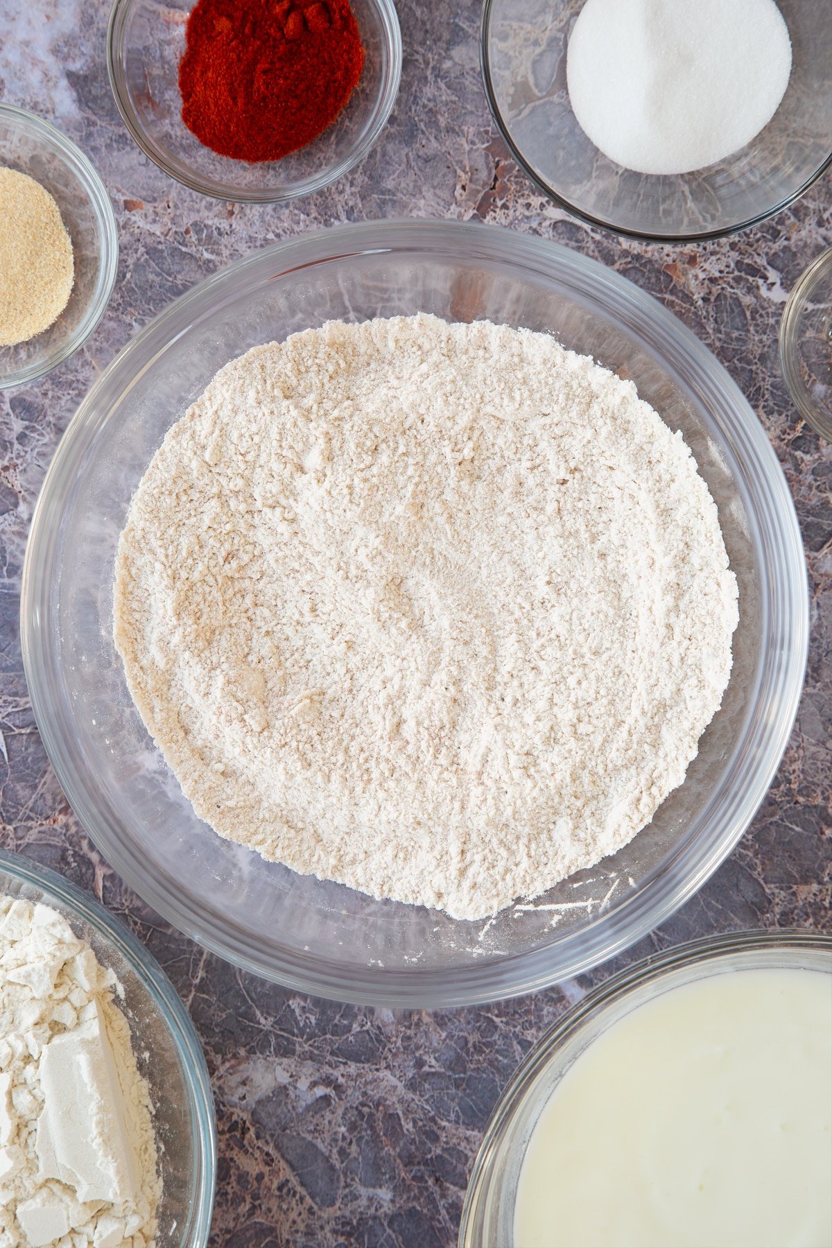 mixed cayenne, garlic and flour in a large clear bowl.