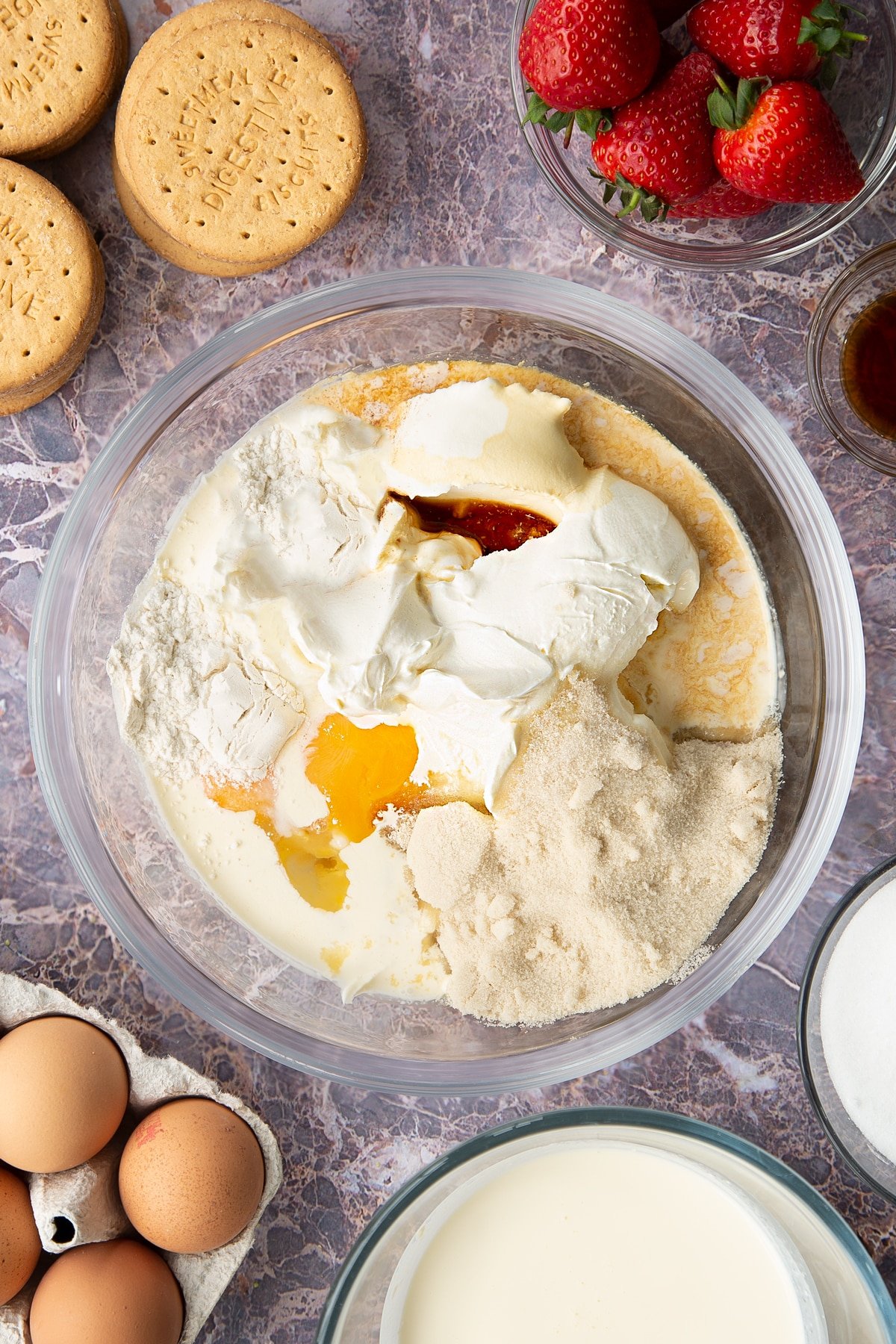 cream cheese, double cream, eggs, flour, sugar and vanilla in a large clear bowl.