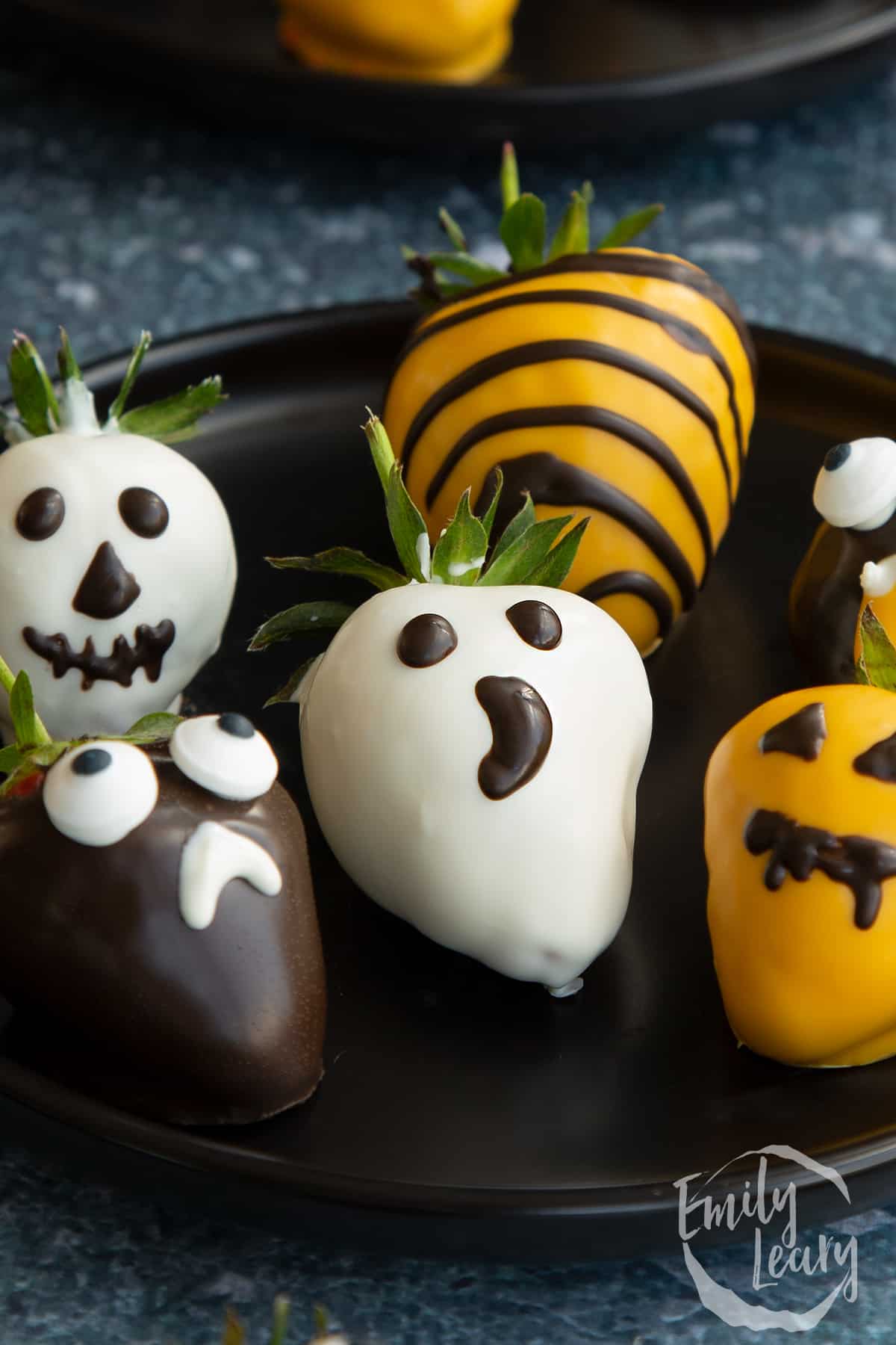 Close up shot of the finished halloween chocolate covered strawberries.