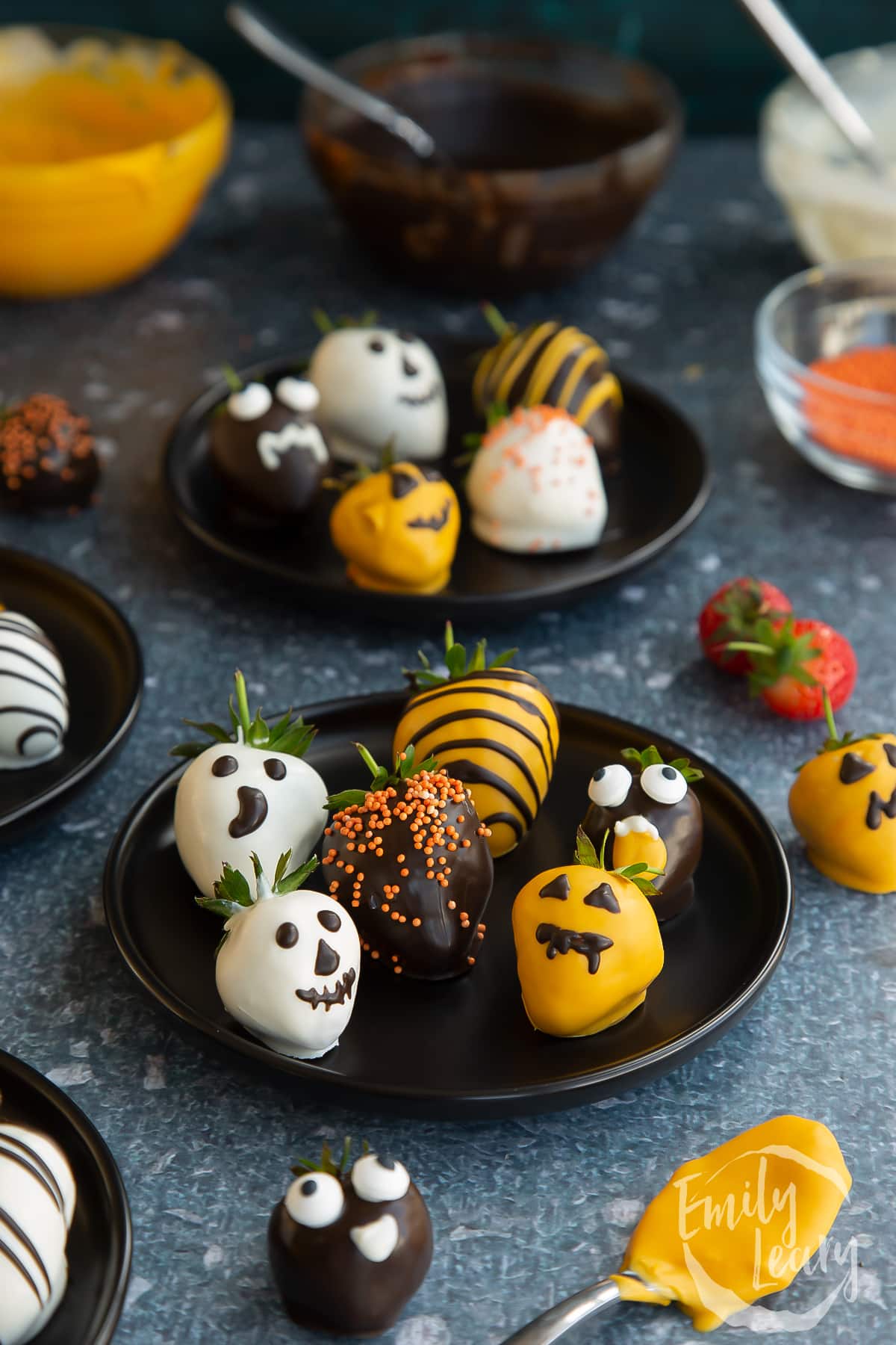 Wide shot of the finished halloween chocolate covered strawberries.