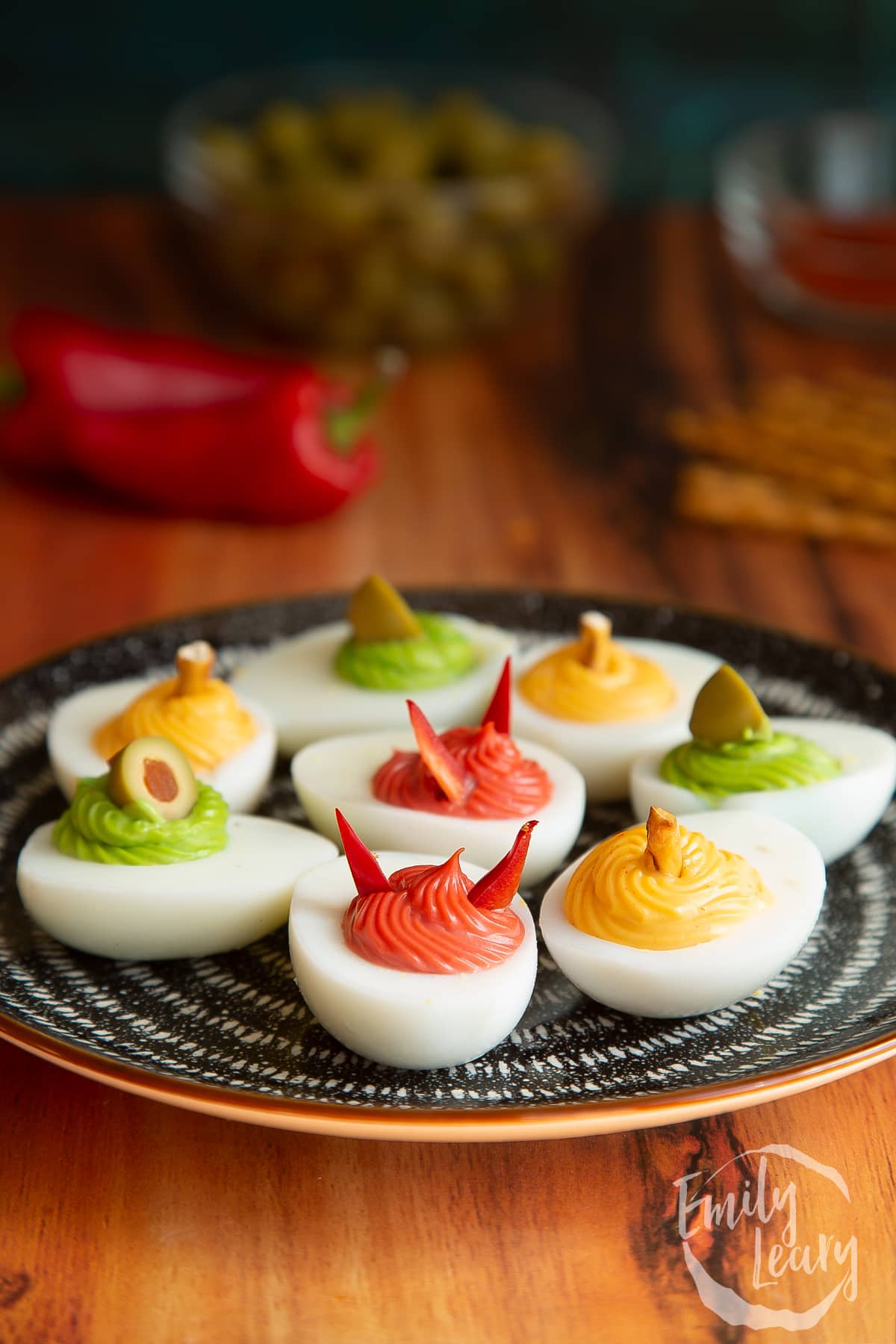Side on shot of a finished plate of deviled eggs.
