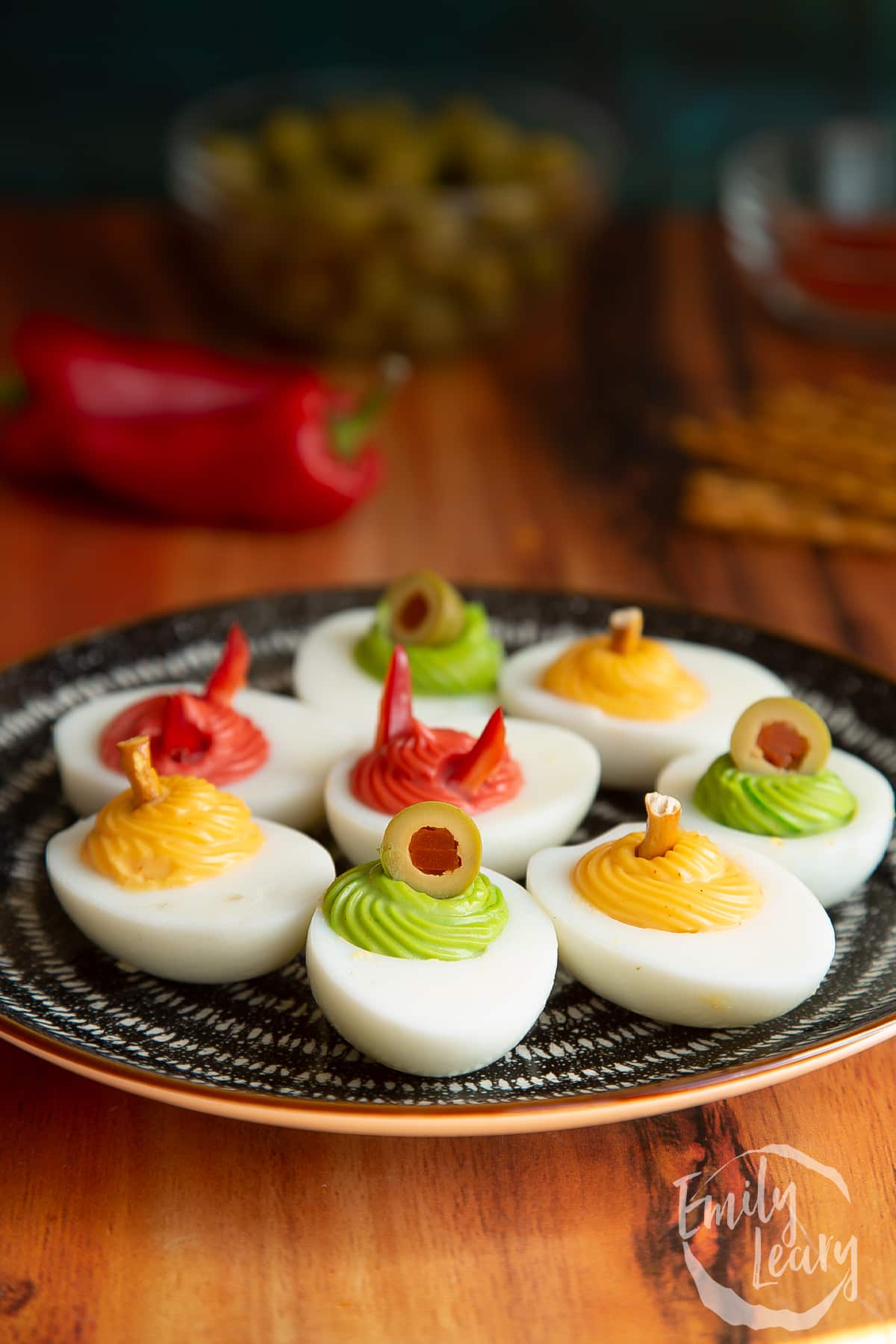 A finished plate of halloween deviled eggs.