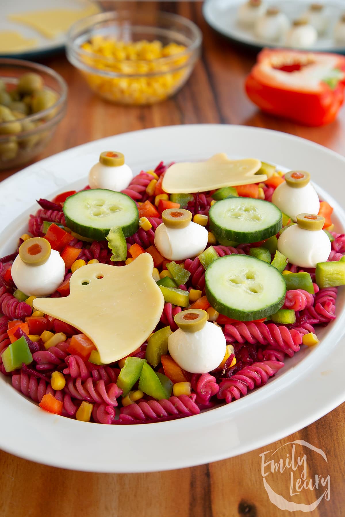 Finished halloween salad served inside a white bowl.