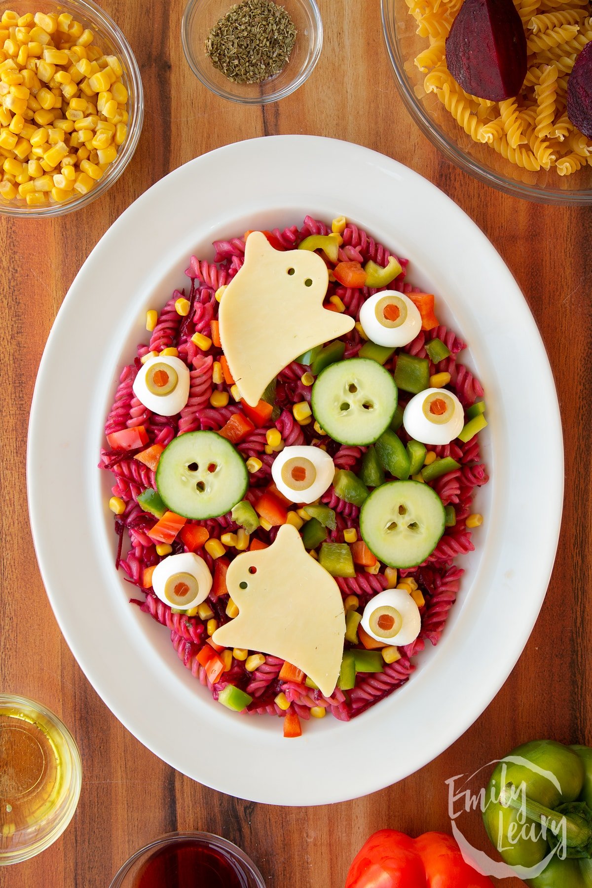 Overhead shot of the finished halloween salad served in a white bowl.