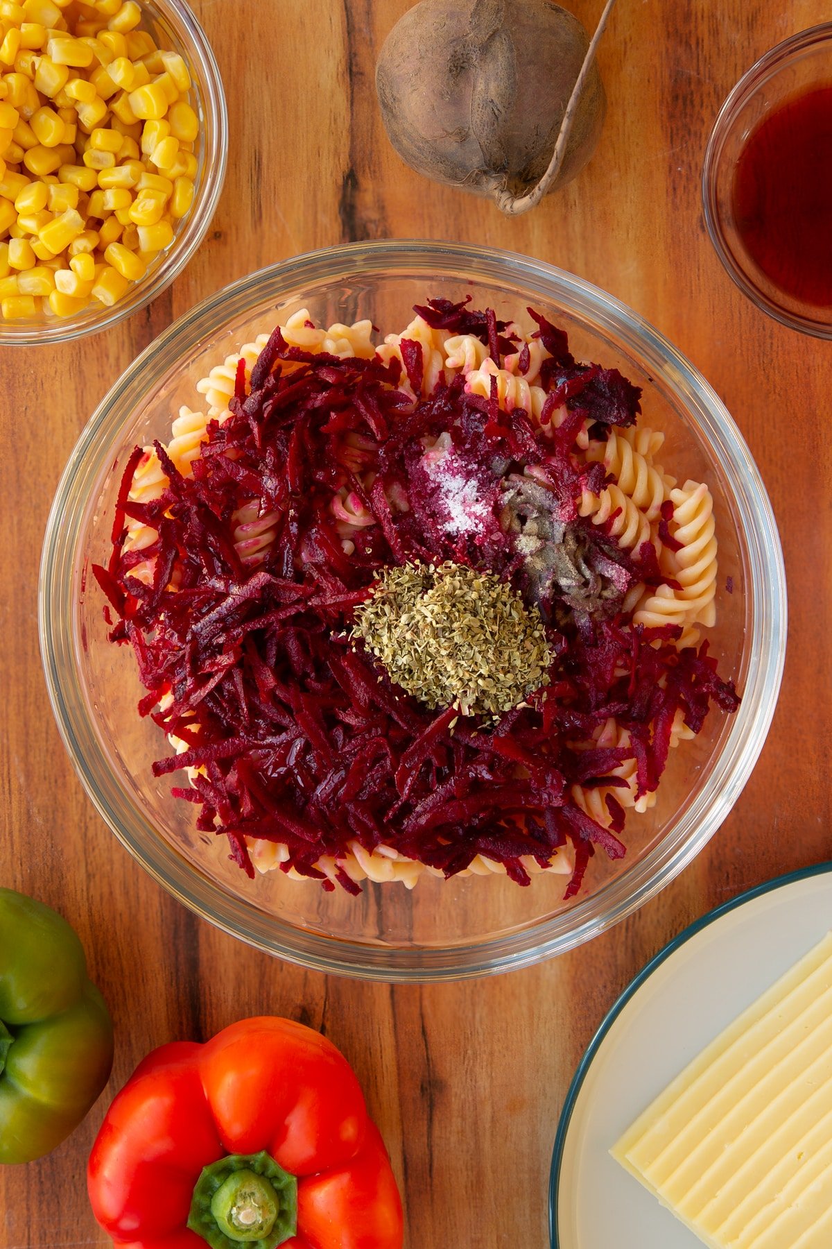 Overhead shot of some of the ingredients required for the halloween salad together in a mixing bowl.