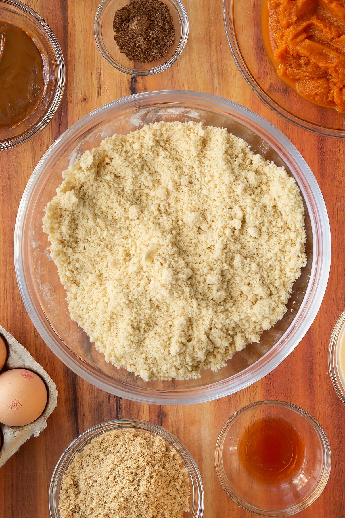 The dry ingredients inside the mixing bowl mixed together.