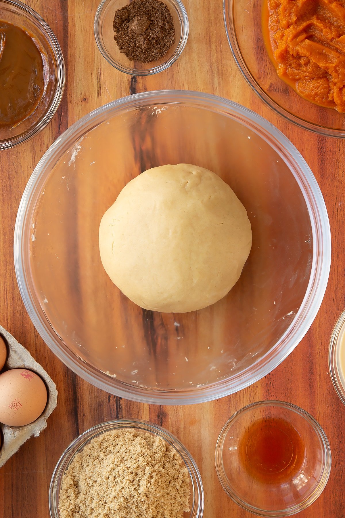 The caramel pumpkin pie pastry having been mixed and kneaded into a ball.
