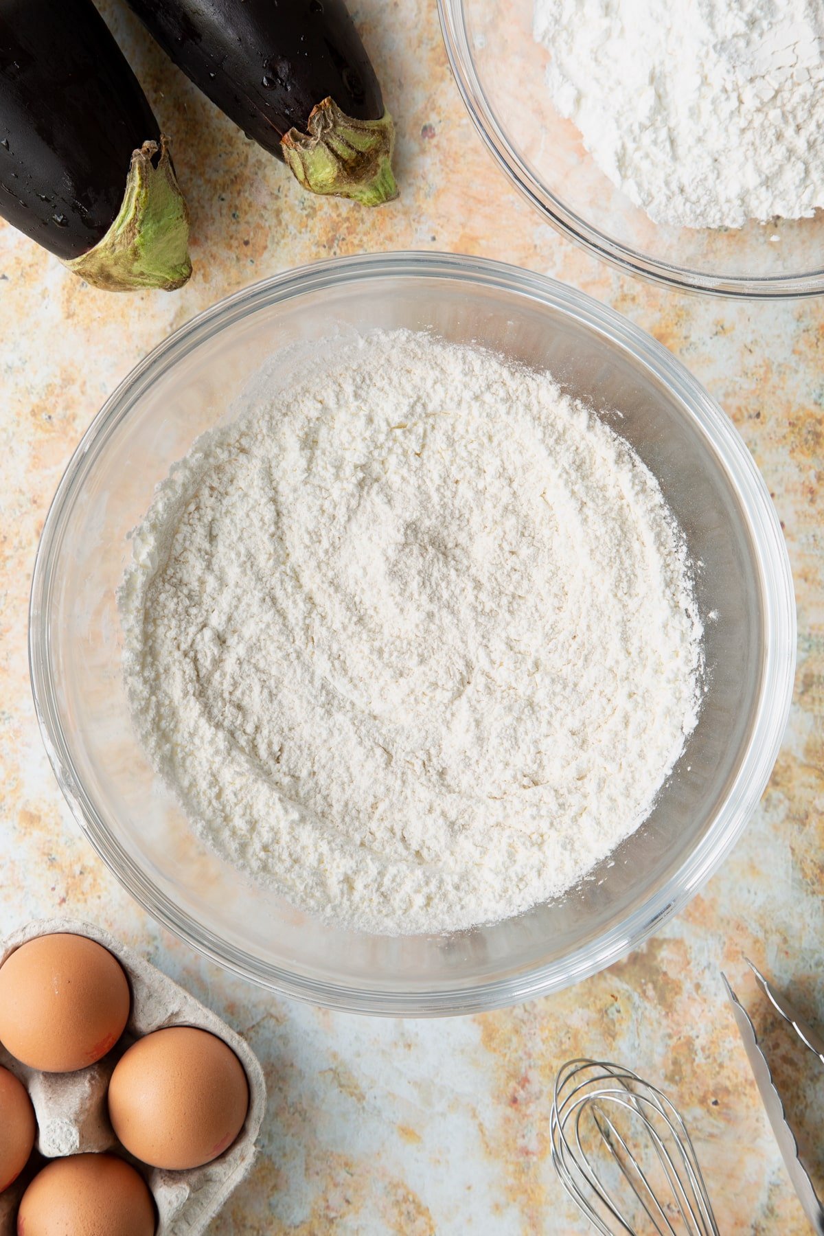 Dry ingredients mixed together in a mixing bowl.