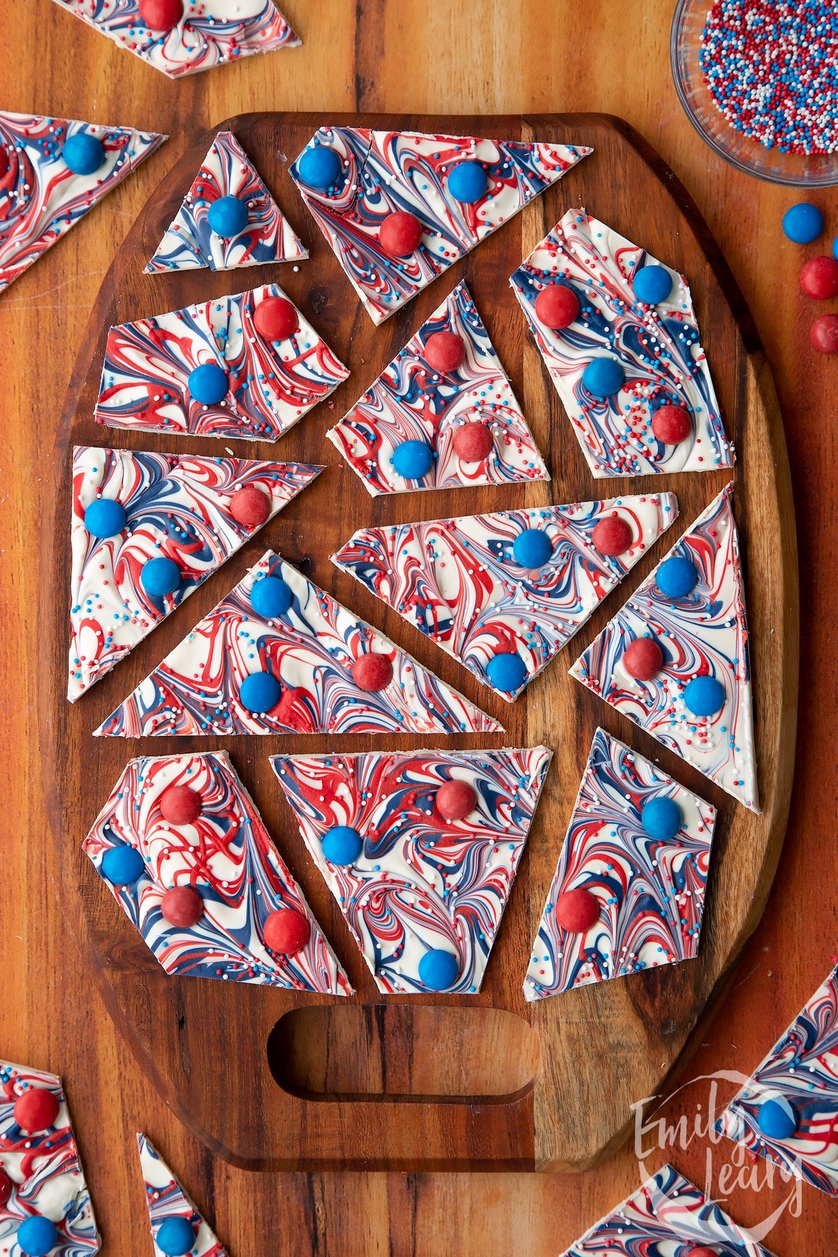 Finished red, white and blue bark served on a decorative wooden board.