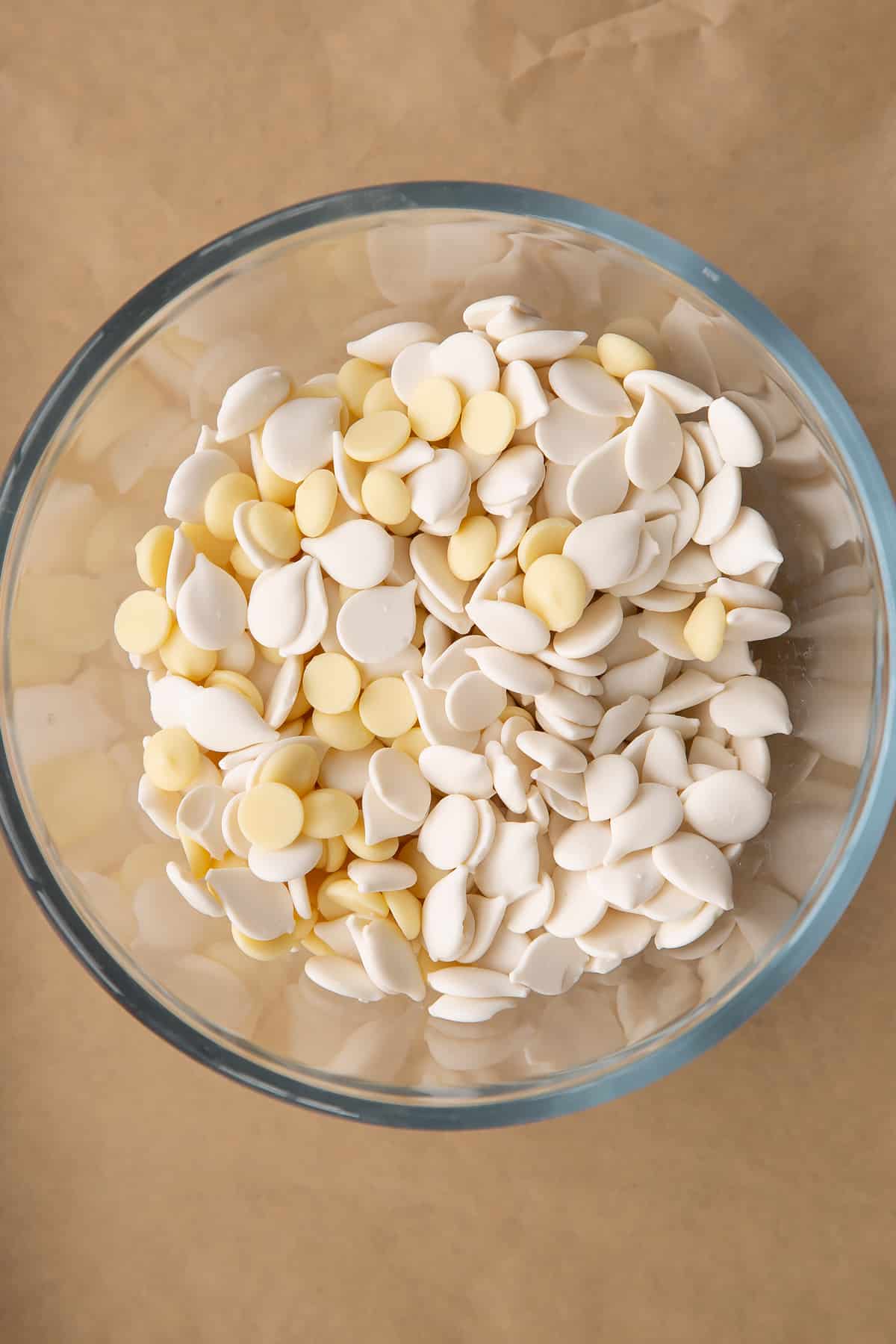 White chocolate and white candy melts in a heatproof bowl.