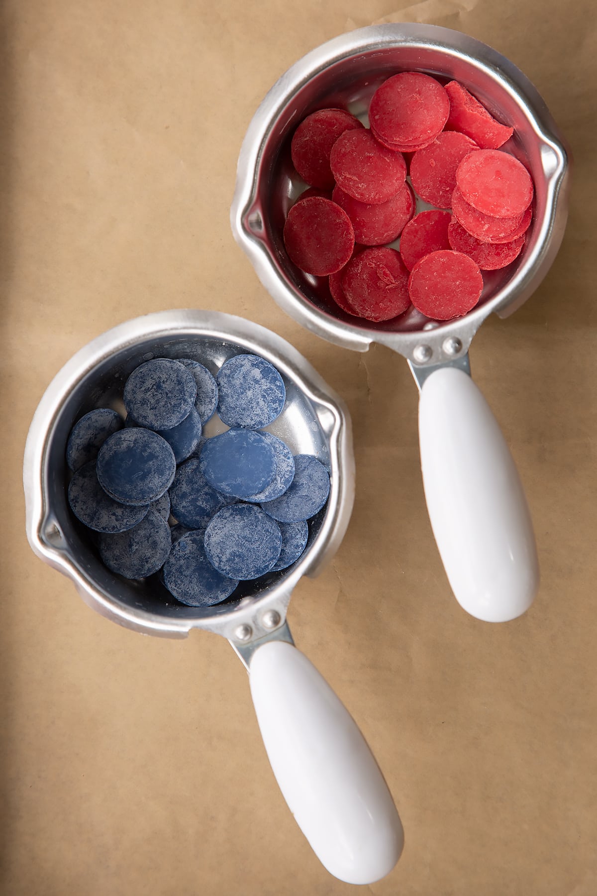 Blue candy and red candy in a small heatproof pan.