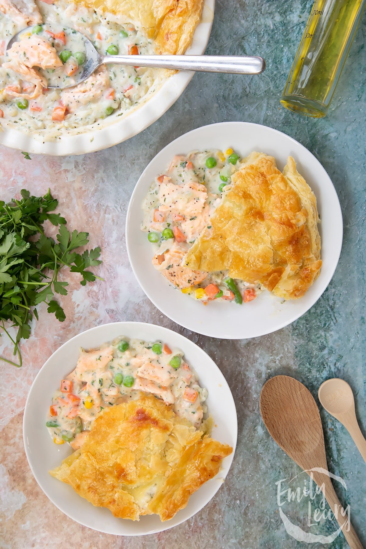 Overhead shot of two bowls filled with the finished salmon pot pie.