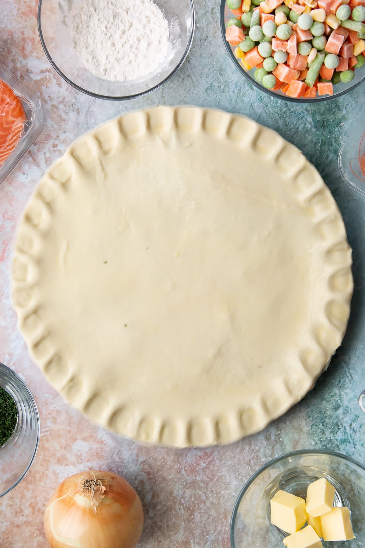 Overhead shot of the uncooked salmon pot pie before being moved to the oven.